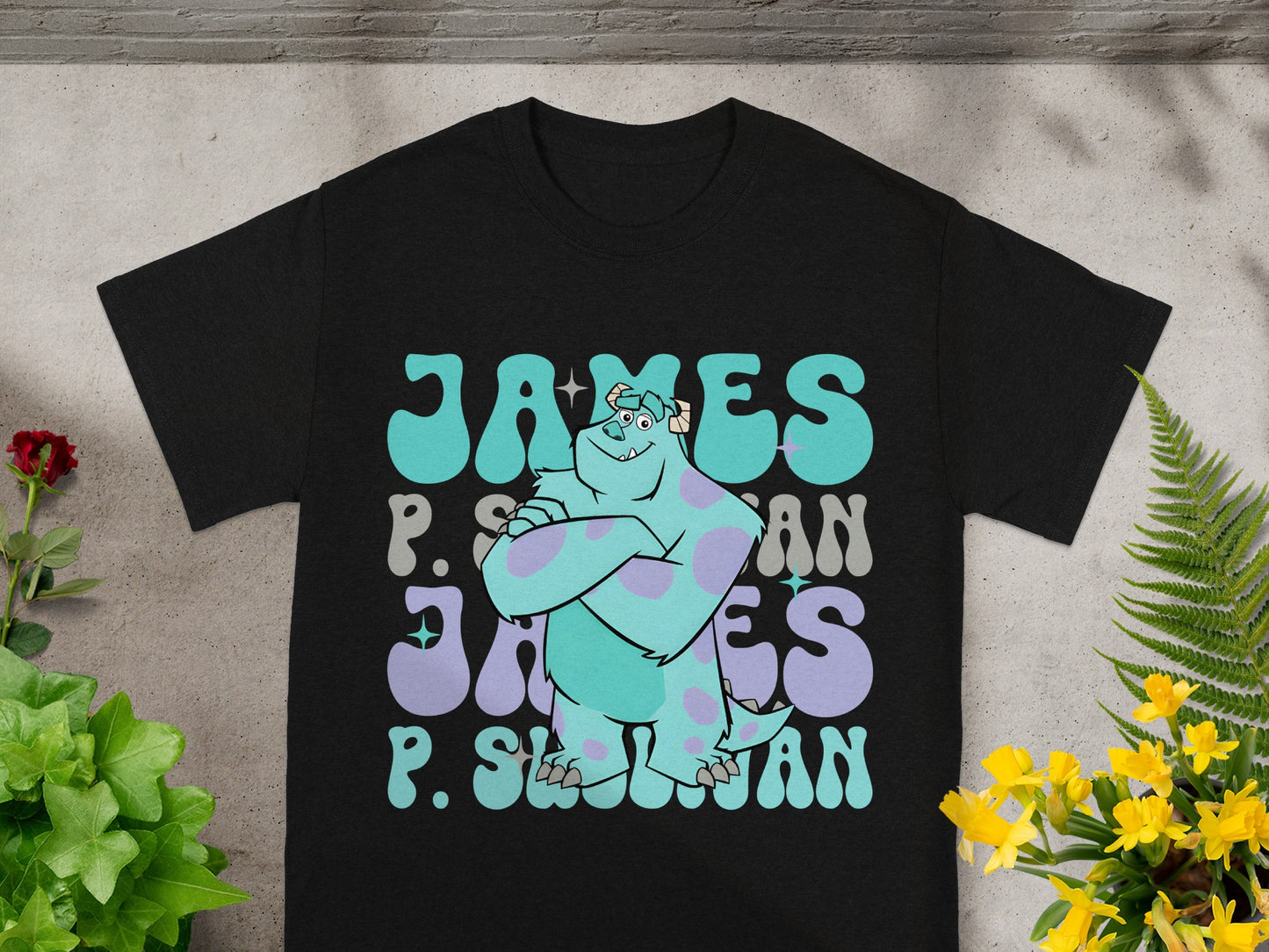 Black t-shirt with a stylized graphic of James P. Sullivan from Monsters, Inc.