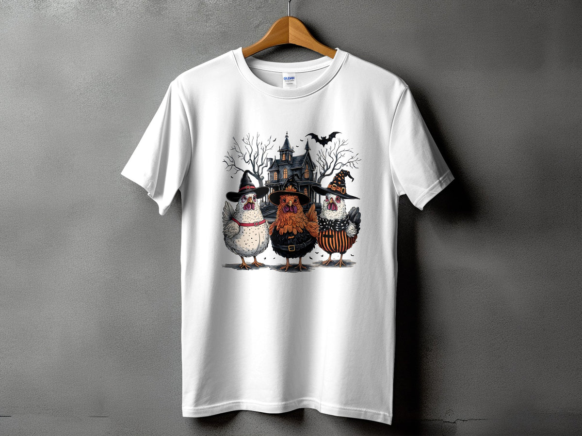 Three chickens in Halloween costumes stand before a haunted house and bare trees.