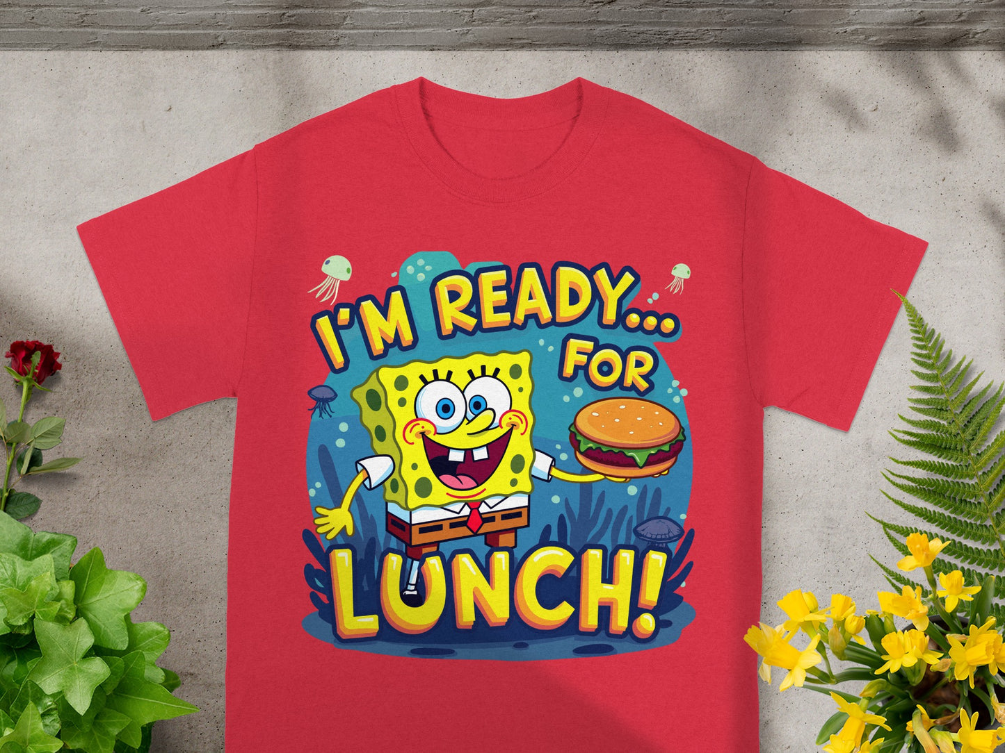 SpongeBob SquarePants holds a burger, "I'M READY... FOR LUNCH!" text, underwater scene.