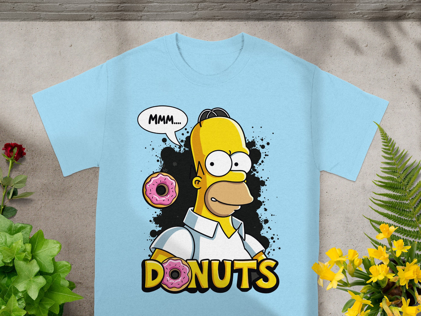 Homer Simpson in a white shirt saying "MMM..." with donuts.