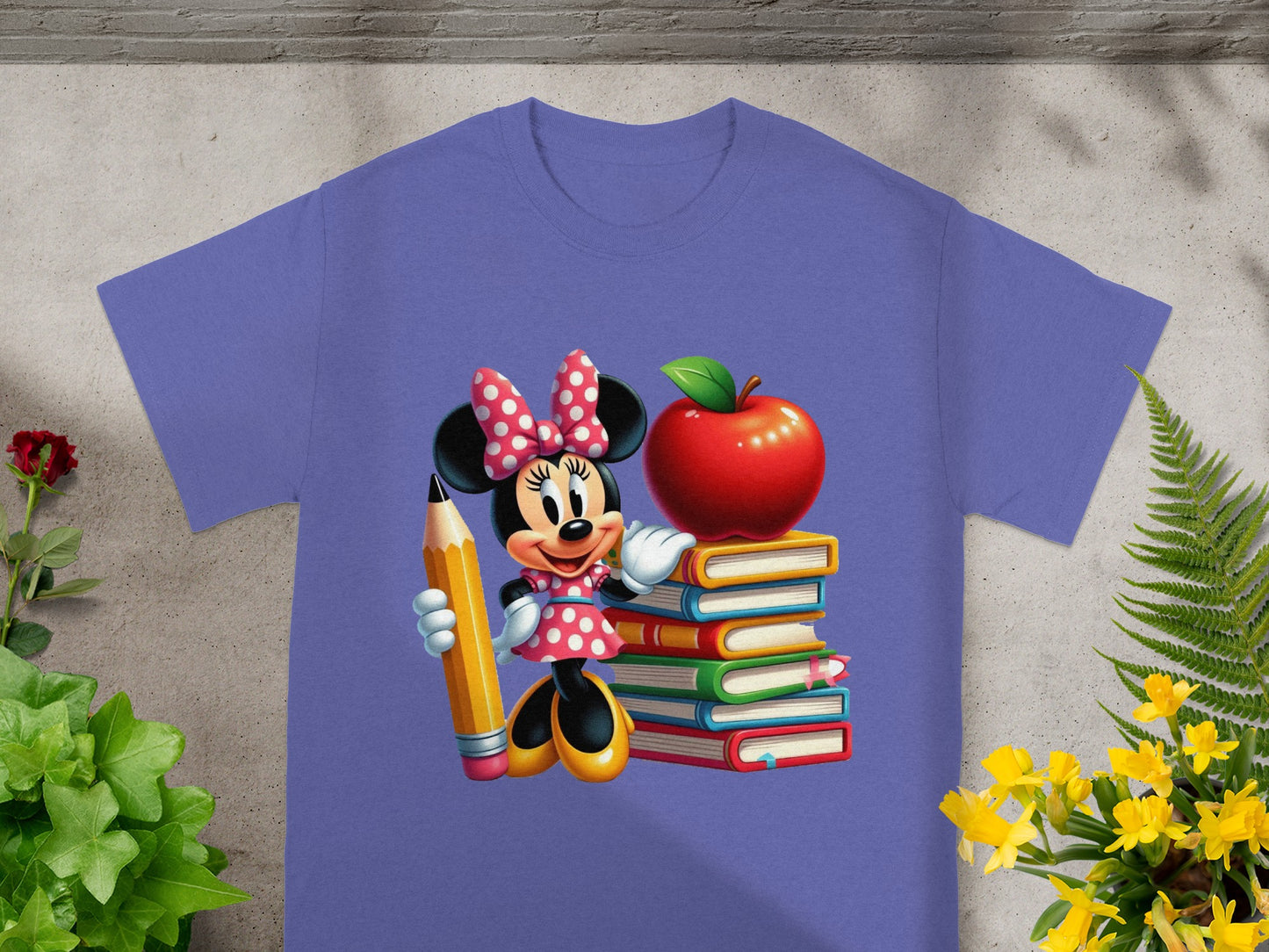 Minnie Mouse with pencil standing beside stack of books and apple.