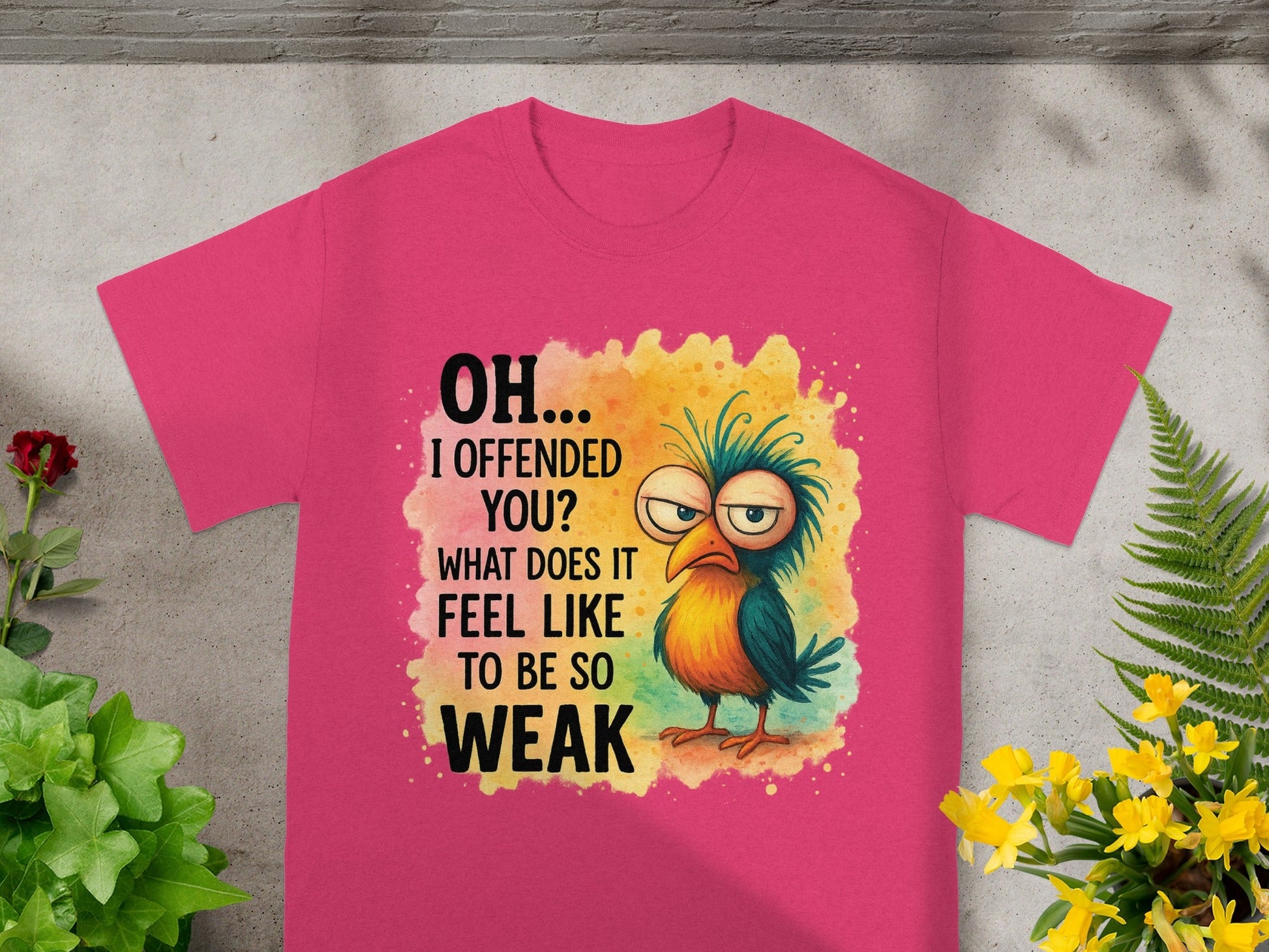 Pink t-shirt with cartoon bird and text "OH... I OFFENDED YOU? WHAT DOES IT FEEL LIKE TO BE SO WEAK".