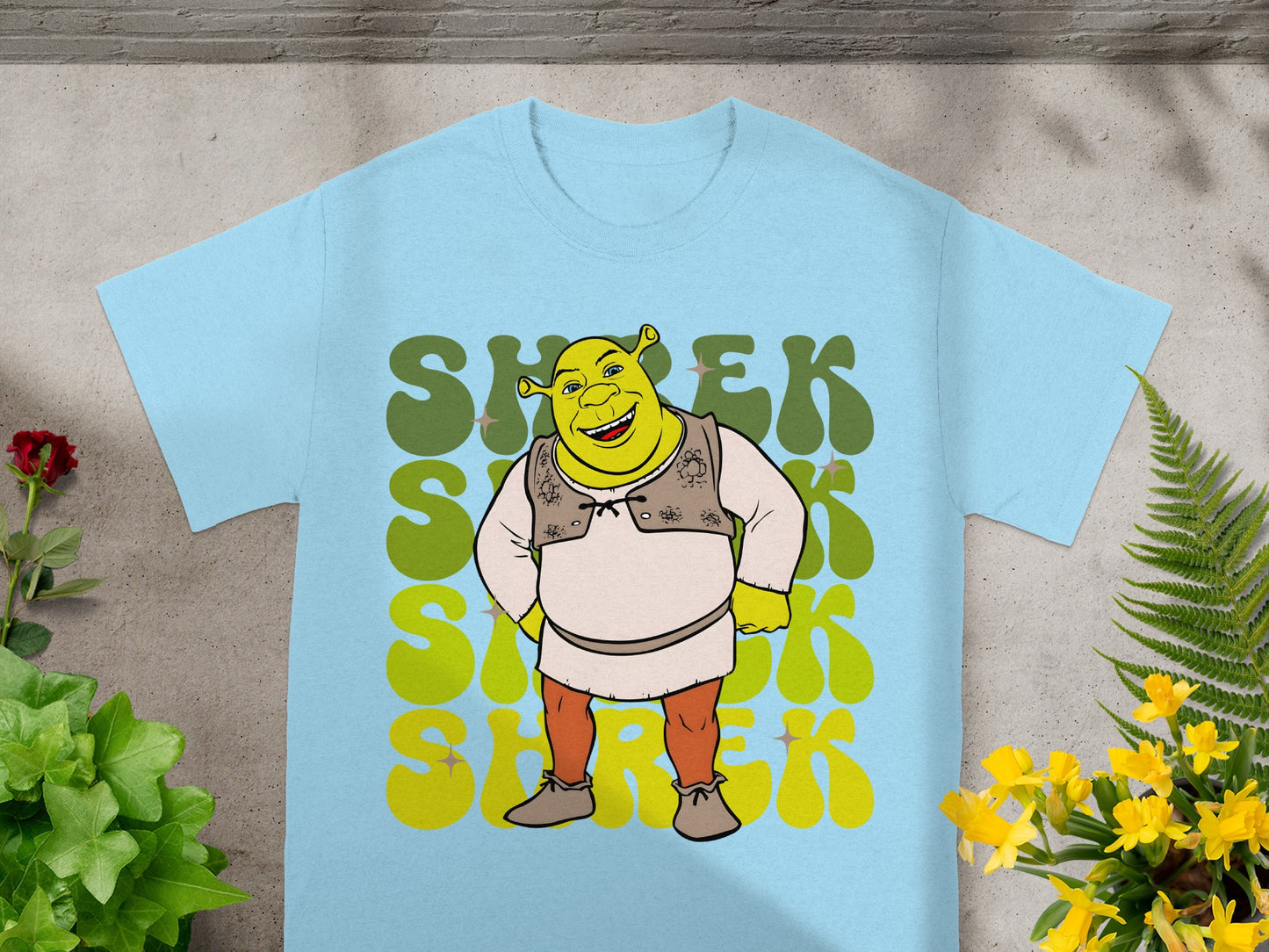 Light blue t-shirt with Shrek graphic and stylized "Shrek" text.