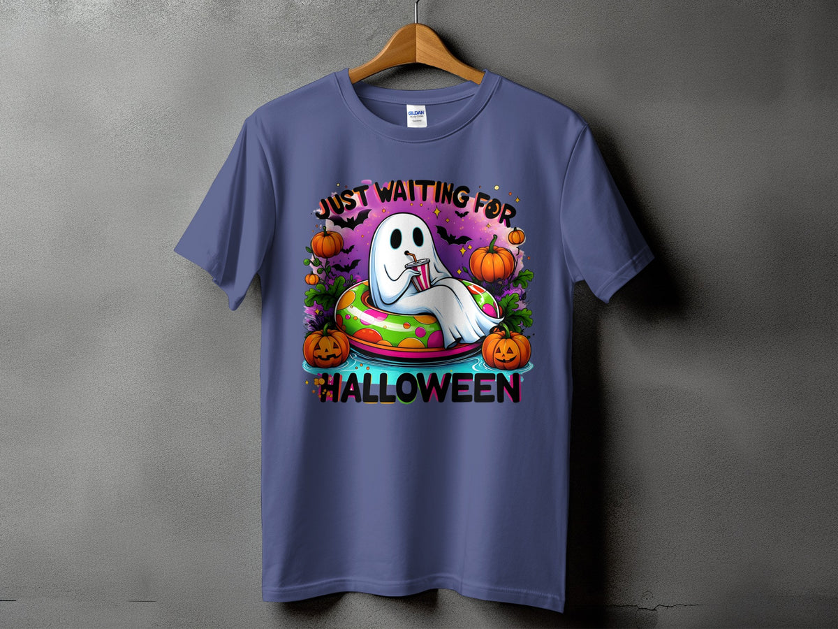 Ghost in inflatable ring with pumpkins and bats, "Just Waiting For Halloween".