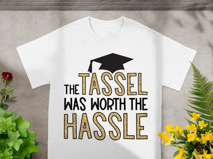 White t-shirt with "The Tassel Was Worth The Hassle" text and graduation cap graphic.