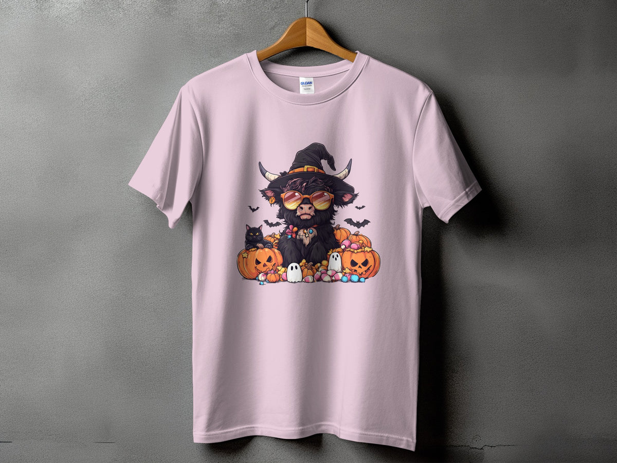 Pink t-shirt with Halloween Highland cow graphic wearing witch hat and sunglasses.