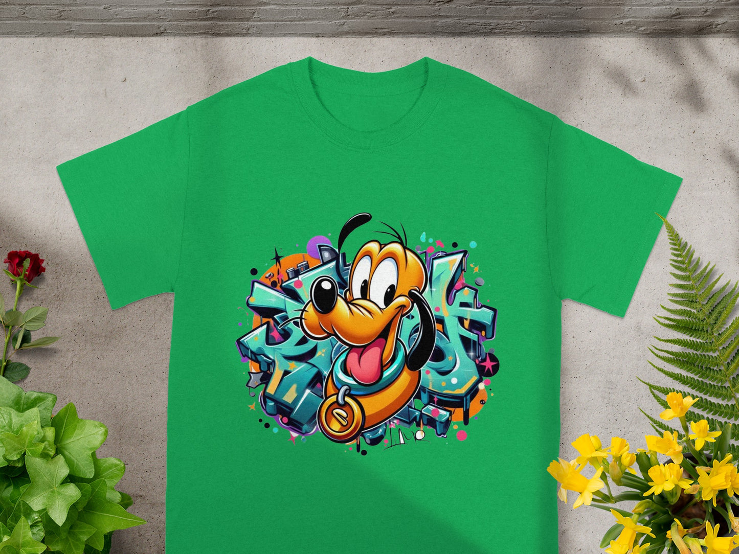 Green t-shirt with cartoon dog Pluto graphic and graffiti background.
