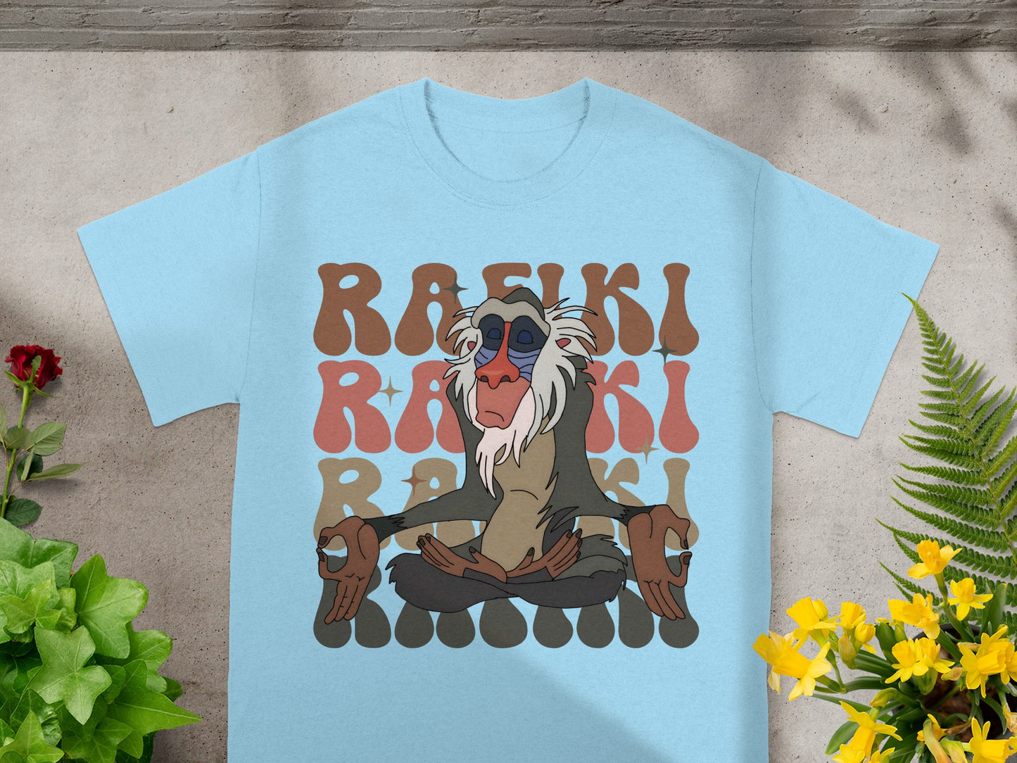 Rafiki from The Lion King meditating on a light blue t-shirt.