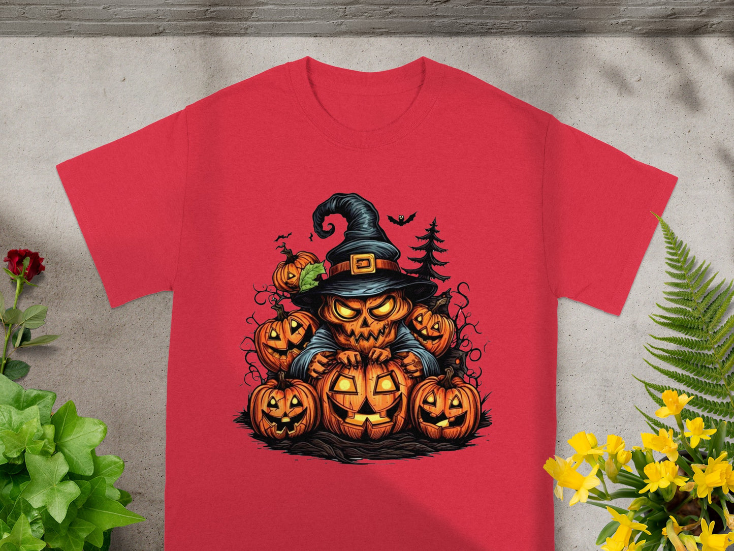 Red t-shirt with a Halloween graphic of a jack-o'-lantern character surrounded by pumpkins.