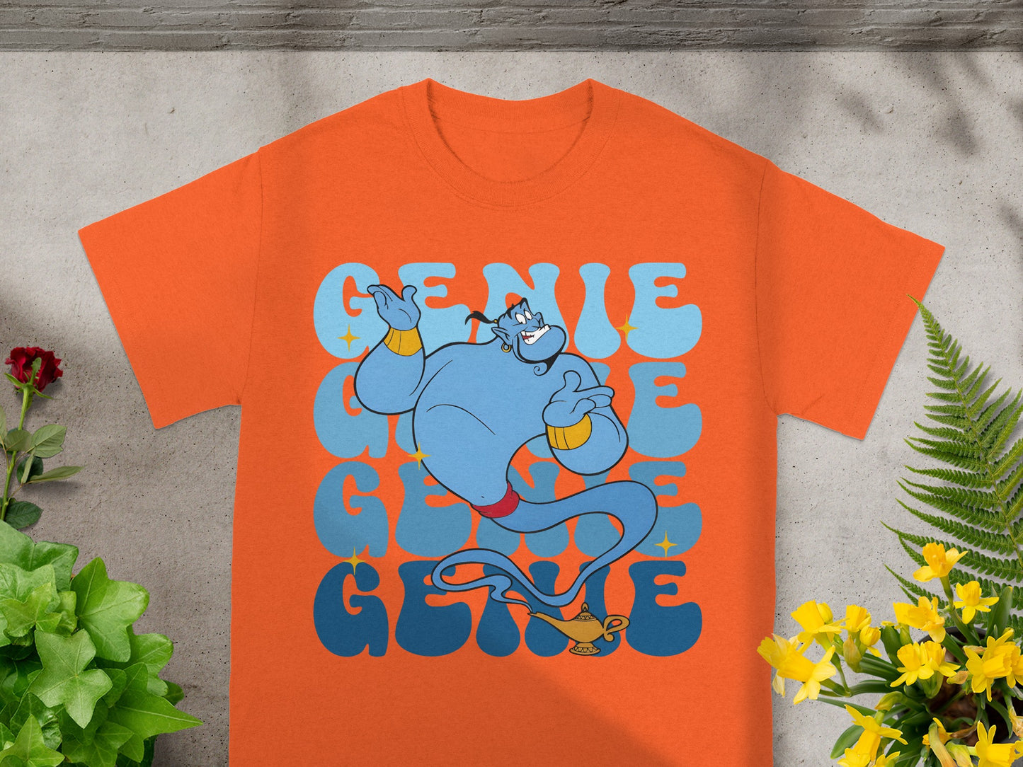 Orange t-shirt with "GENIE" in stylized blue text and a genie illustration.