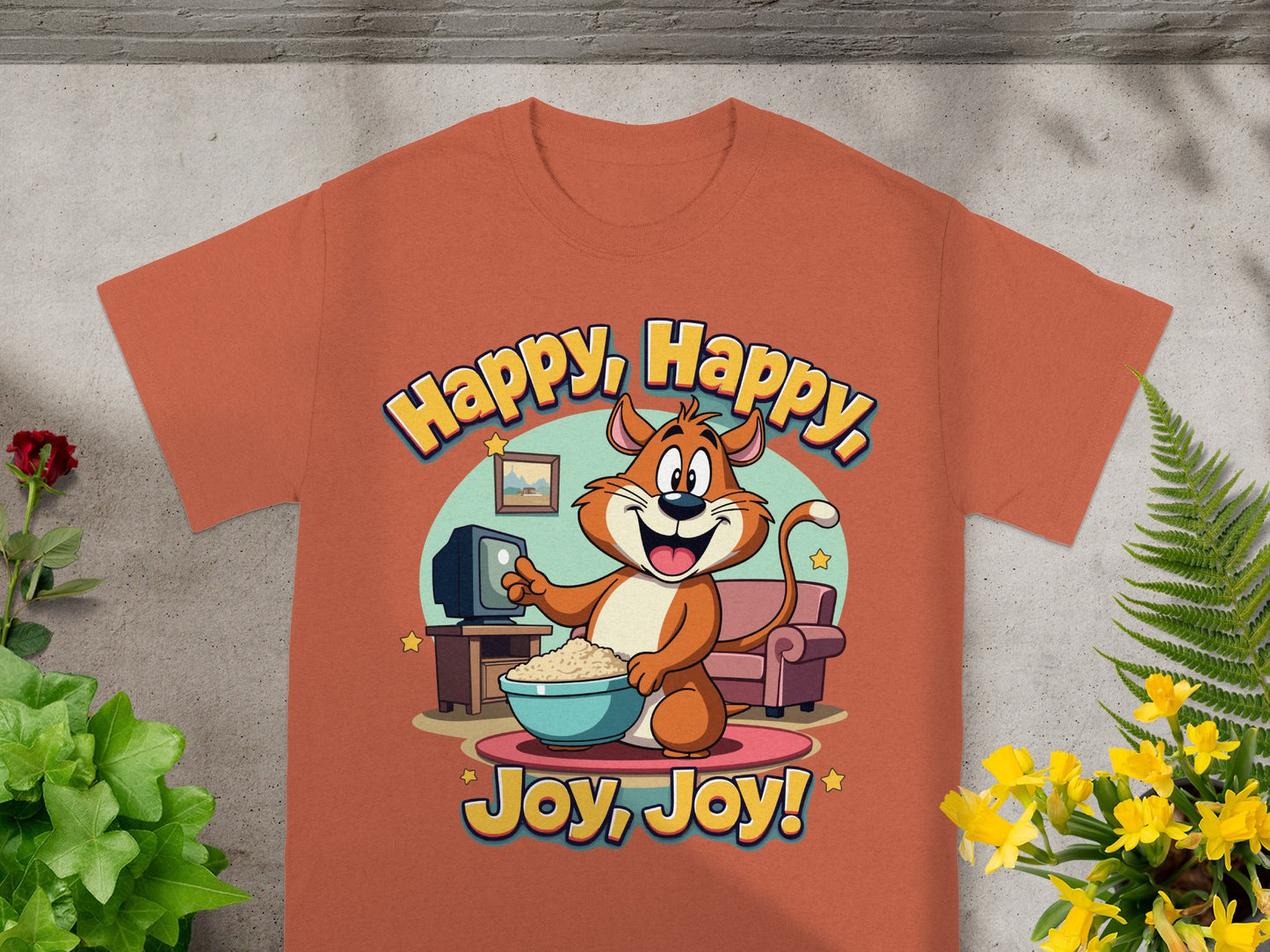 Orange t-shirt with cartoon cat holding popcorn in front of TV with text "Happy, Happy, Joy, Joy!".