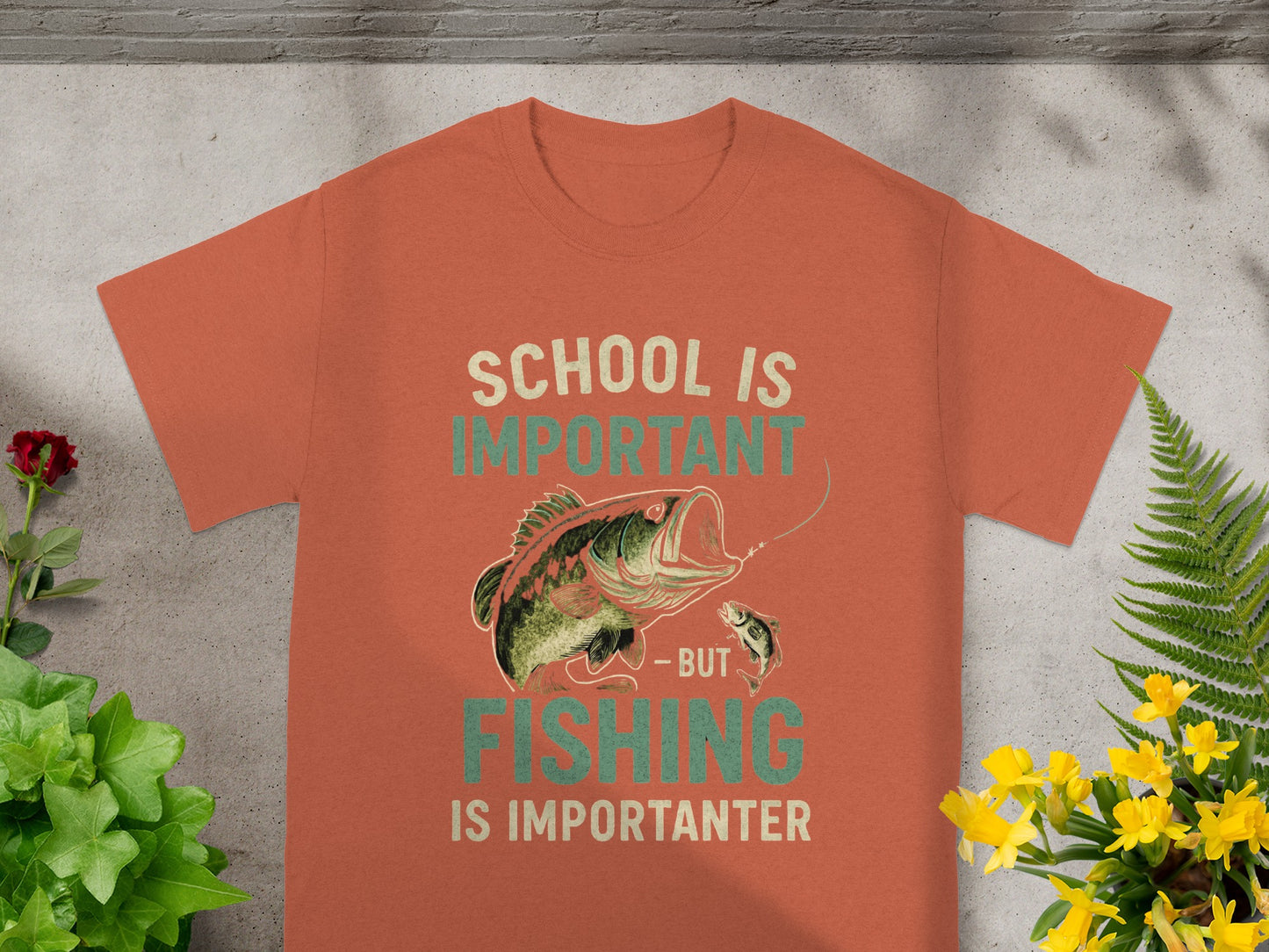 Orange t-shirt with text "School is Important - But Fishing is Importanter" and a fish graphic.