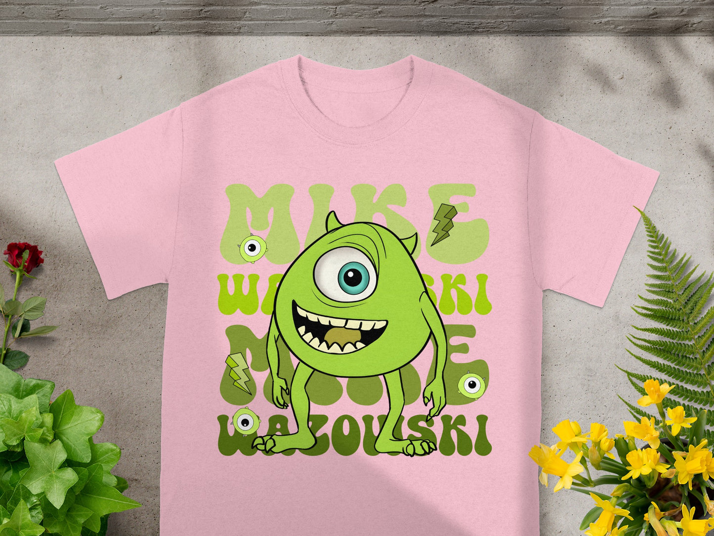 Pink t-shirt featuring Mike Wazowski character from Monsters Inc.
