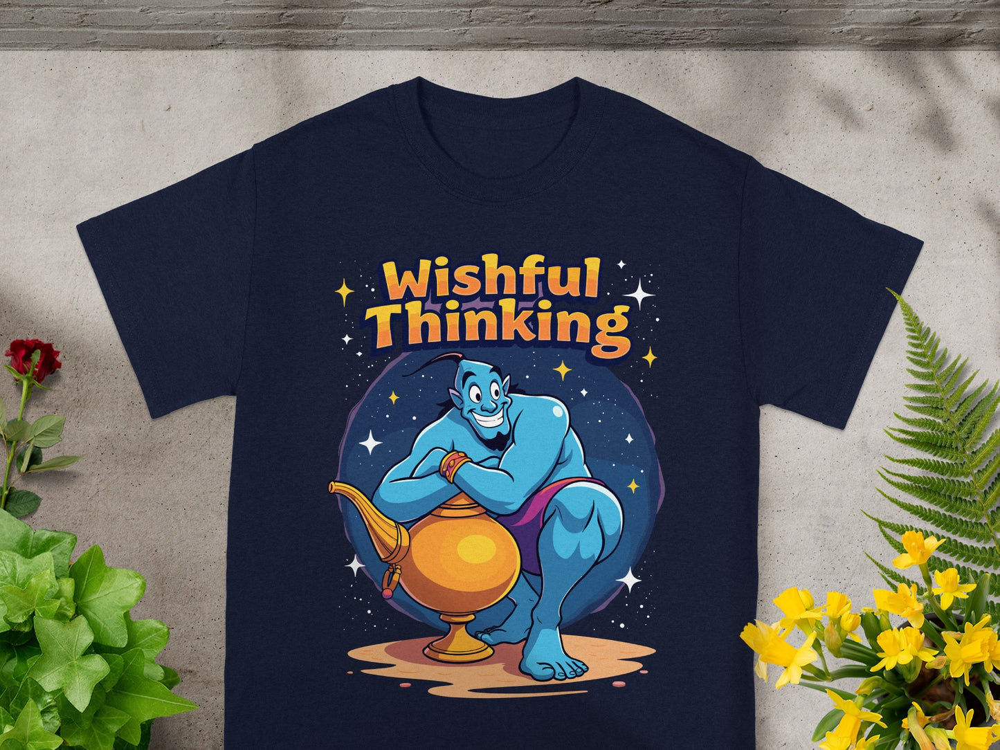 Navy t-shirt with cartoon genie holding a lamp and "Wishful Thinking" text.