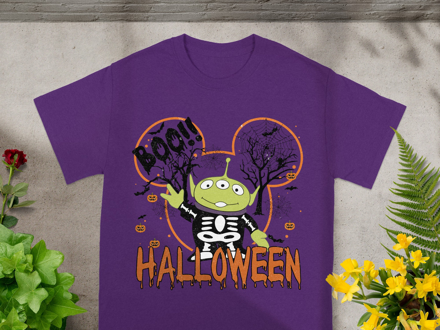 Purple t-shirt with Toy Story alien in skeleton costume, Boo!!, and Halloween text.