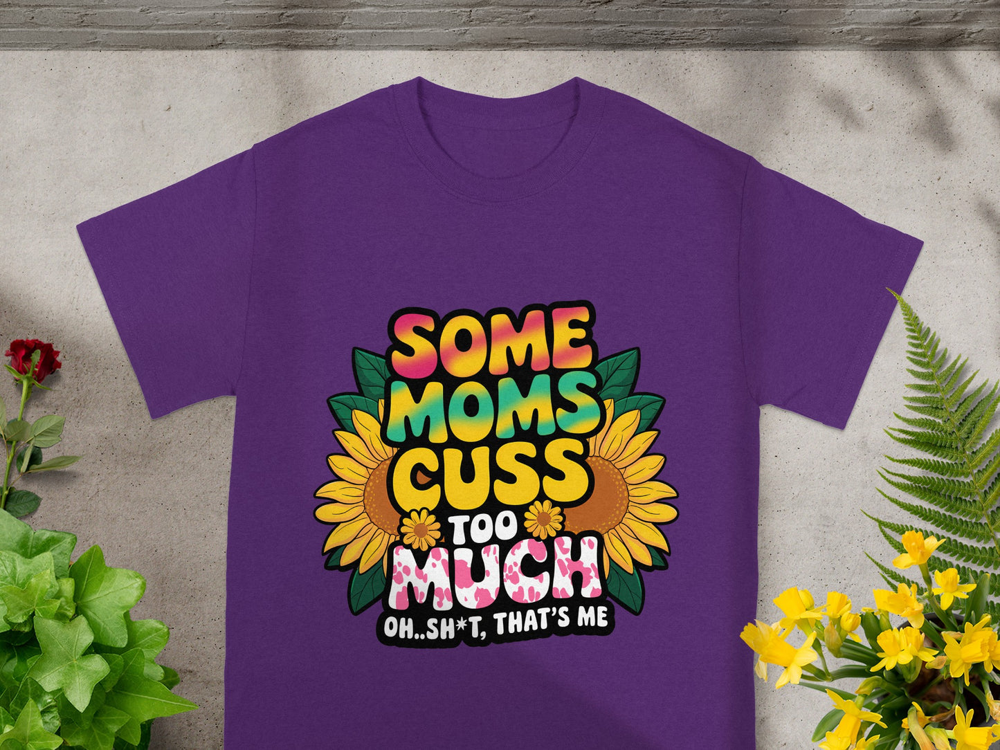 Purple t-shirt with graphic "Some Moms Cuss Too Much Oh..Sh*t, That's Me."