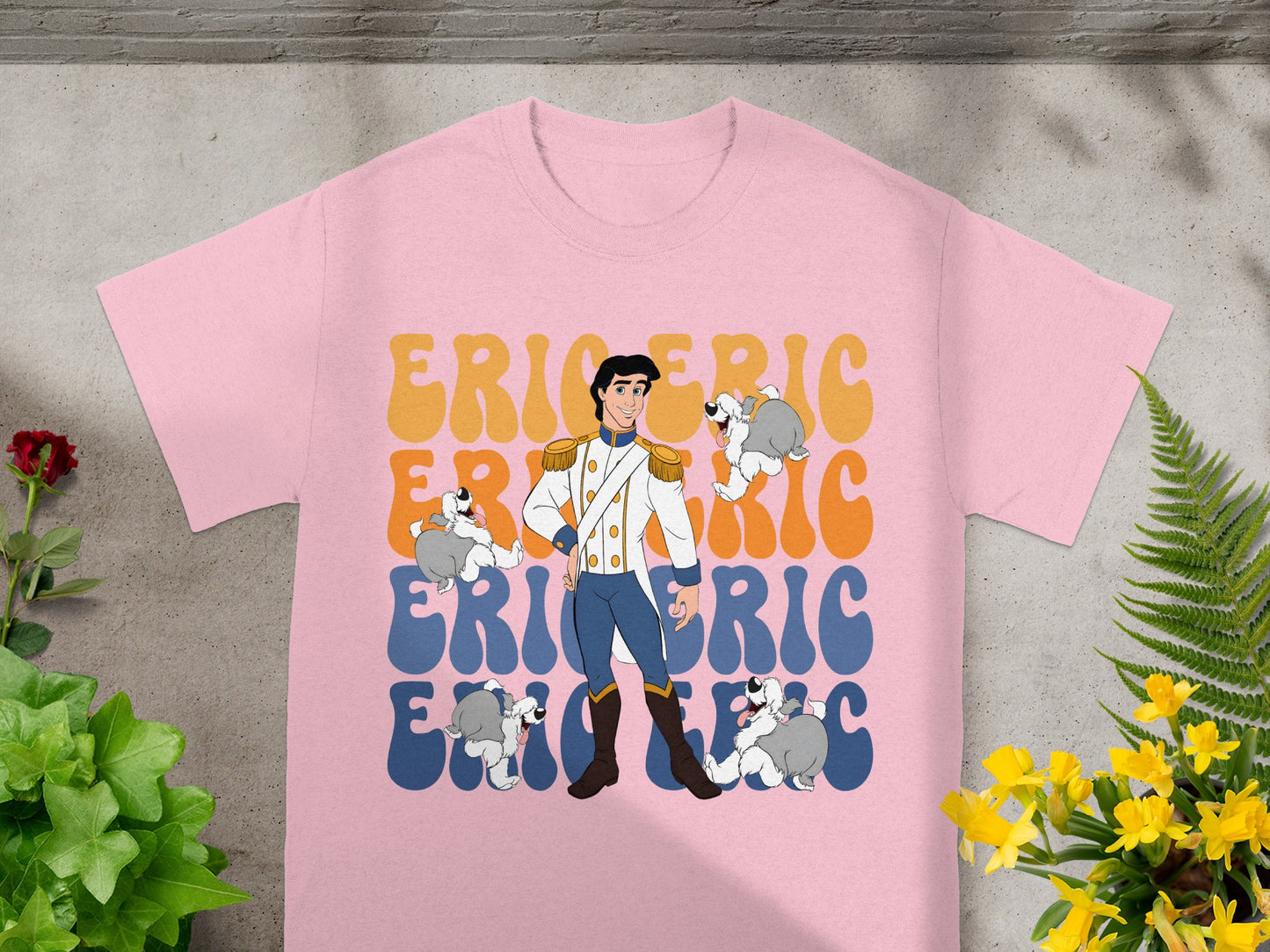 Pink t-shirt with Prince Eric and Max the dog graphic in retro font.