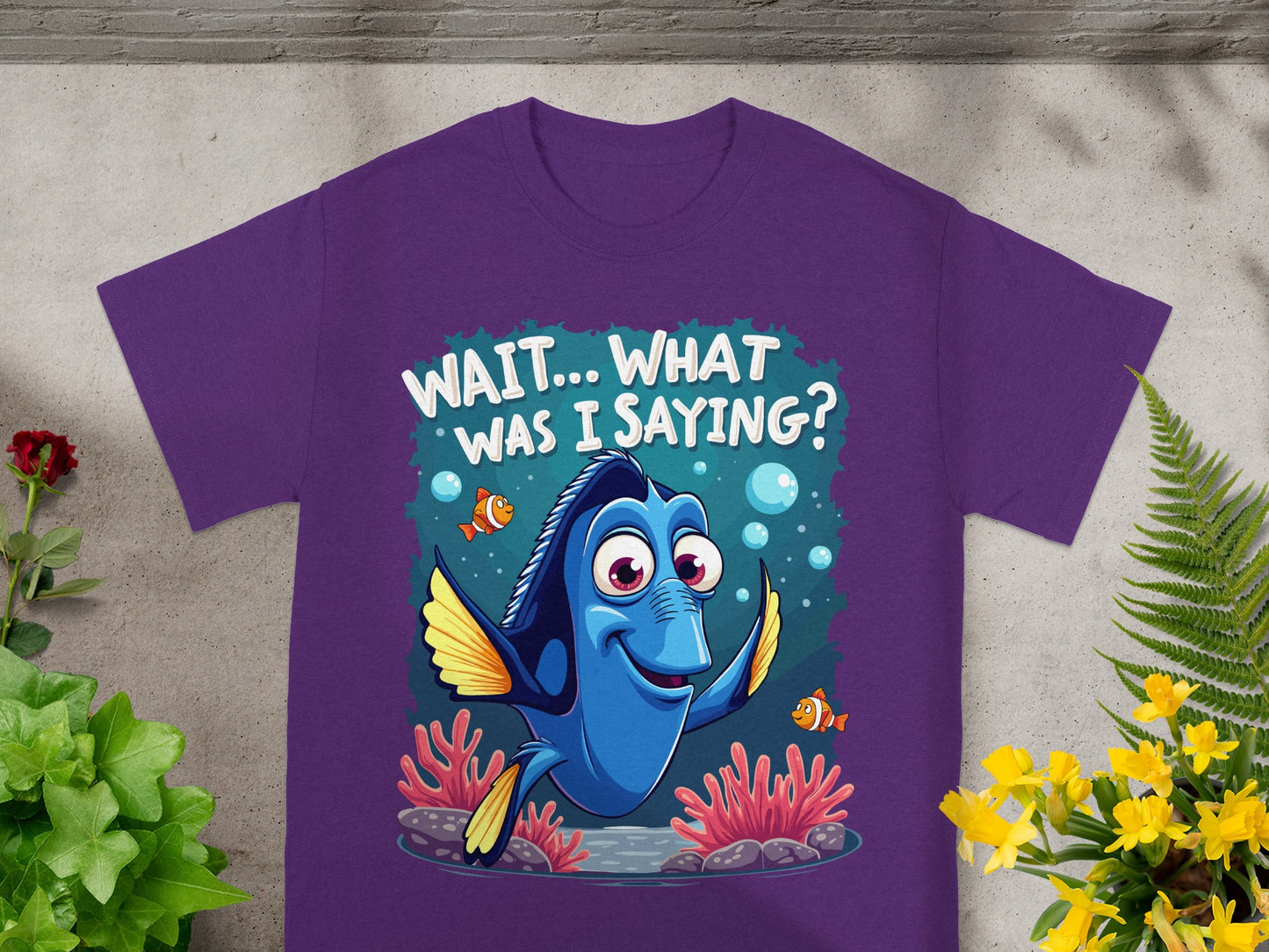 Purple t-shirt with Dory from Finding Nemo saying "WAIT... WHAT WAS I SAYING?"