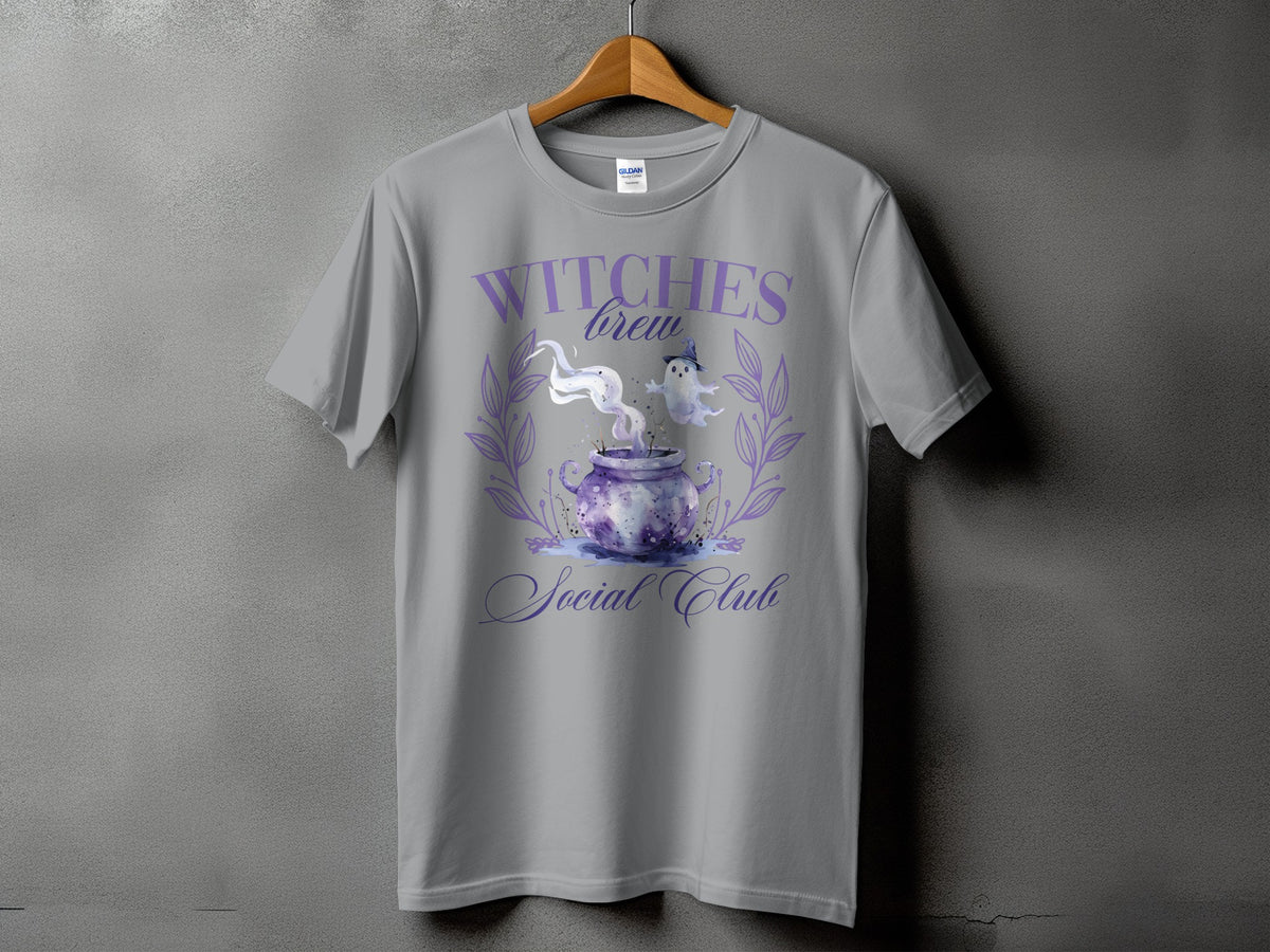 Gray t-shirt with "Witches Brew Social Club" text and a cauldron graphic.