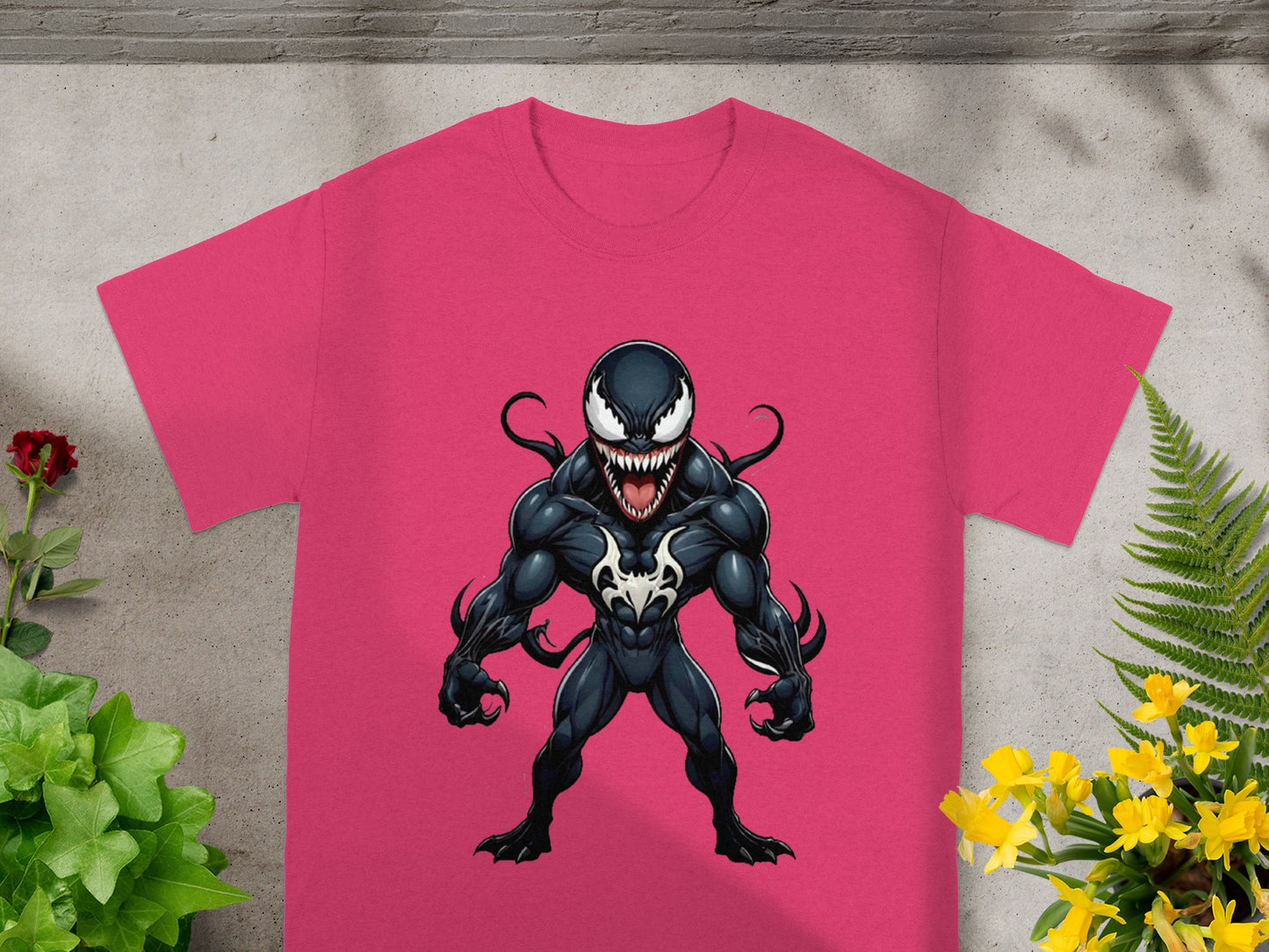 Pink t-shirt with Venom character graphic.