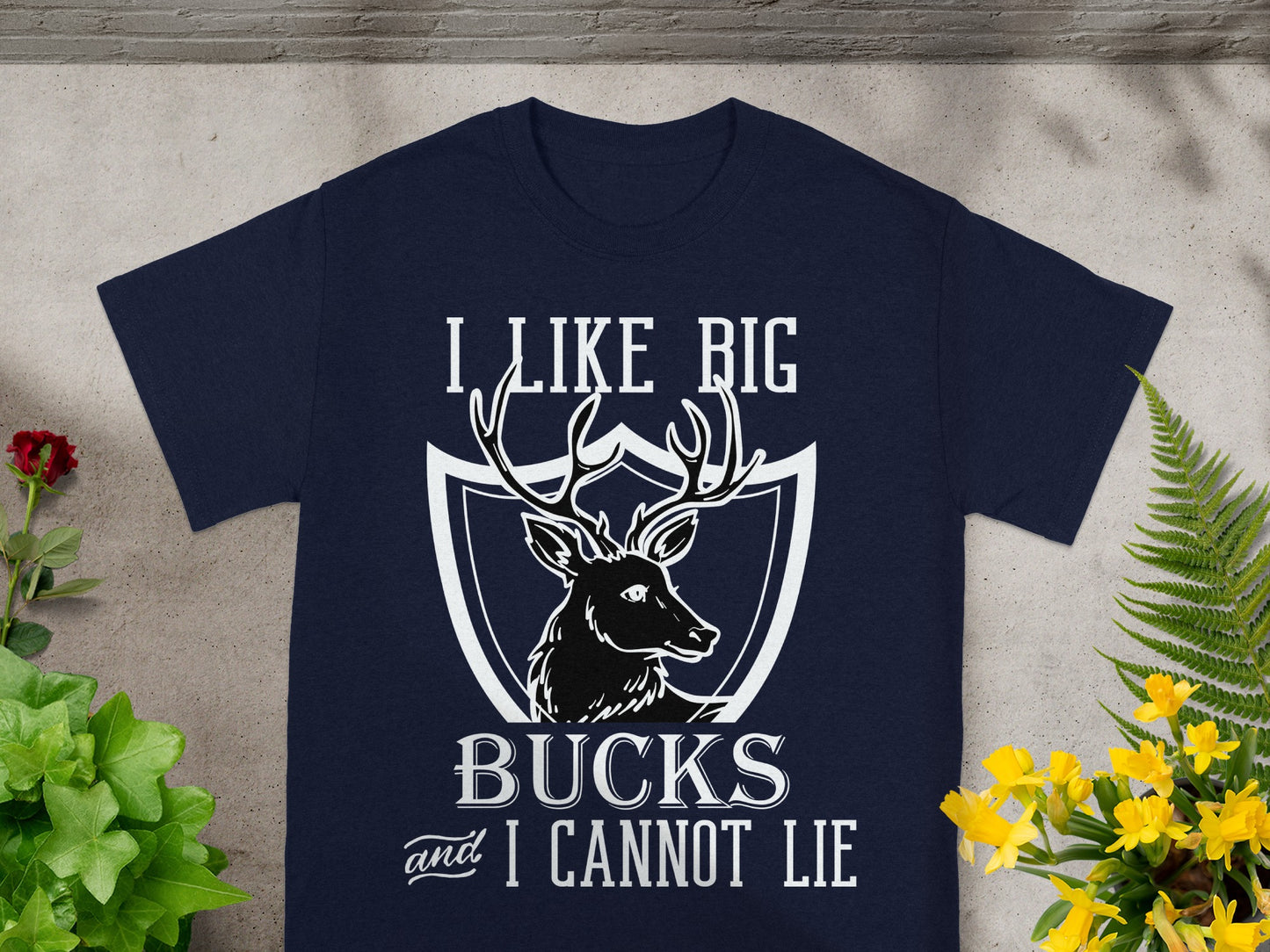 Navy t-shirt with a deer graphic and text "I LIKE BIG BUCKS and I CANNOT LIE".