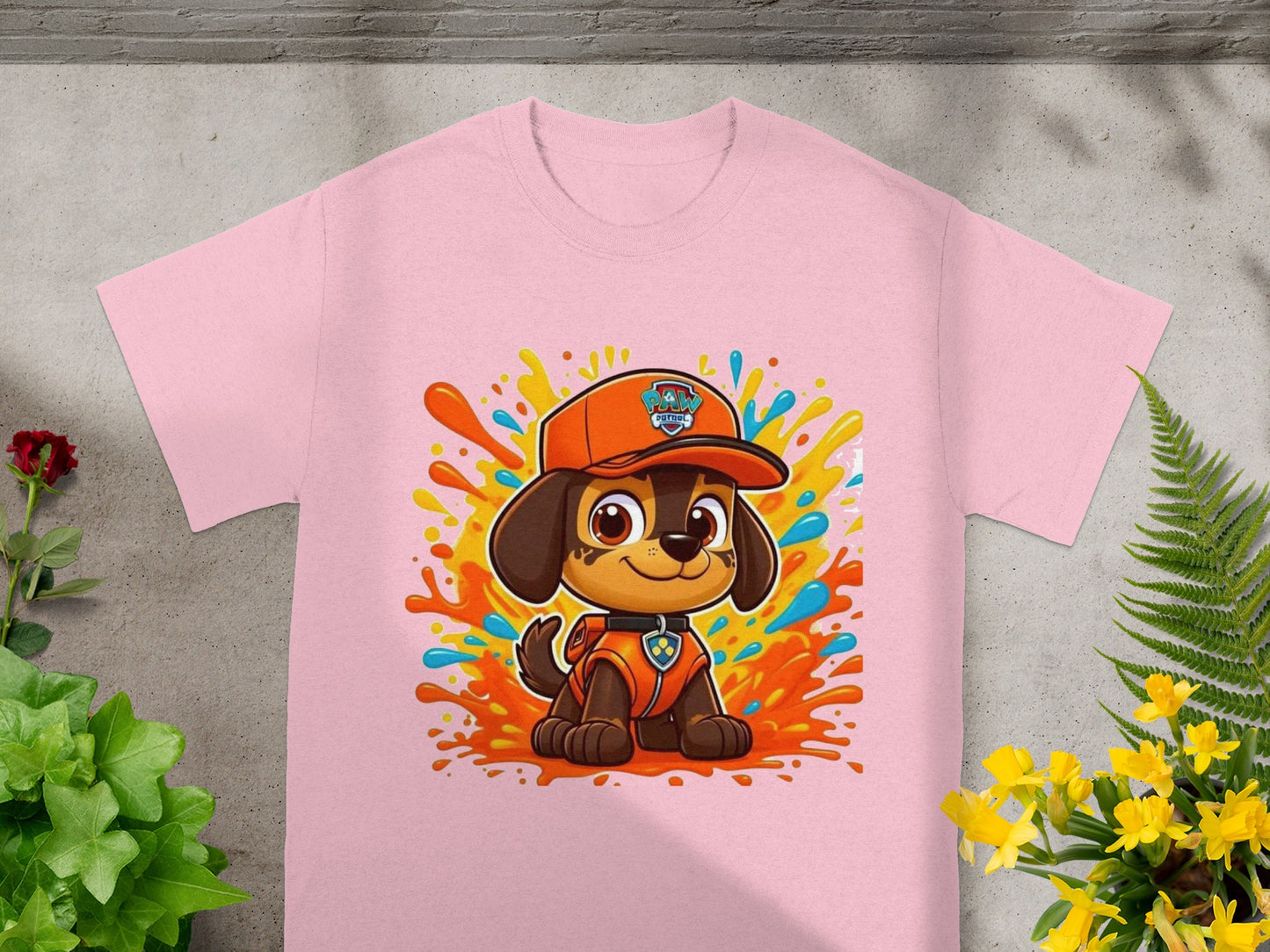 Paw Patrol character Chase on pink t-shirt with colorful splashes.