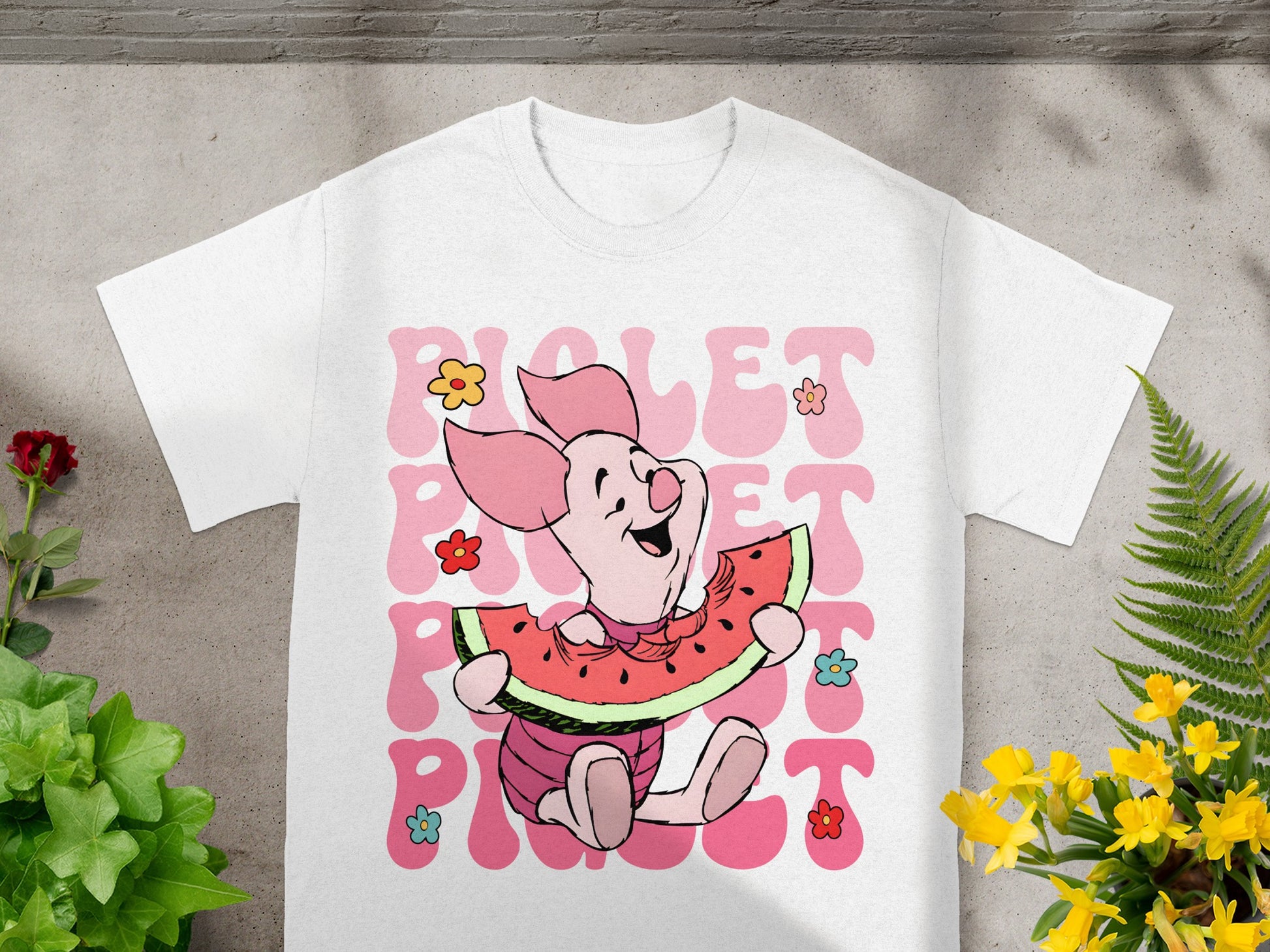 Winnie the Pooh's Piglet character eating a watermelon slice.
