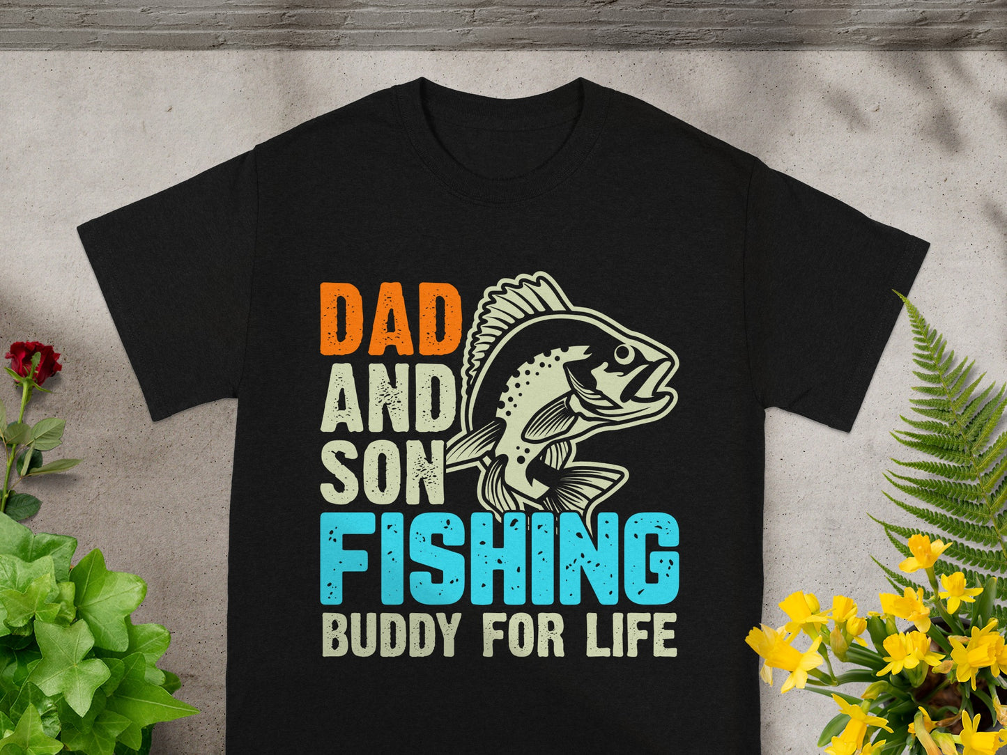 Black t-shirt with "DAD AND SON FISHING BUDDY FOR LIFE" text and fish graphic.