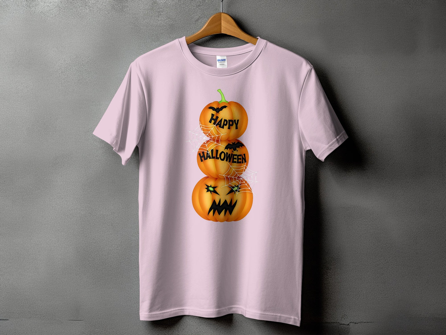 Pink t-shirt with stacked pumpkins saying "Happy Halloween" and bats.