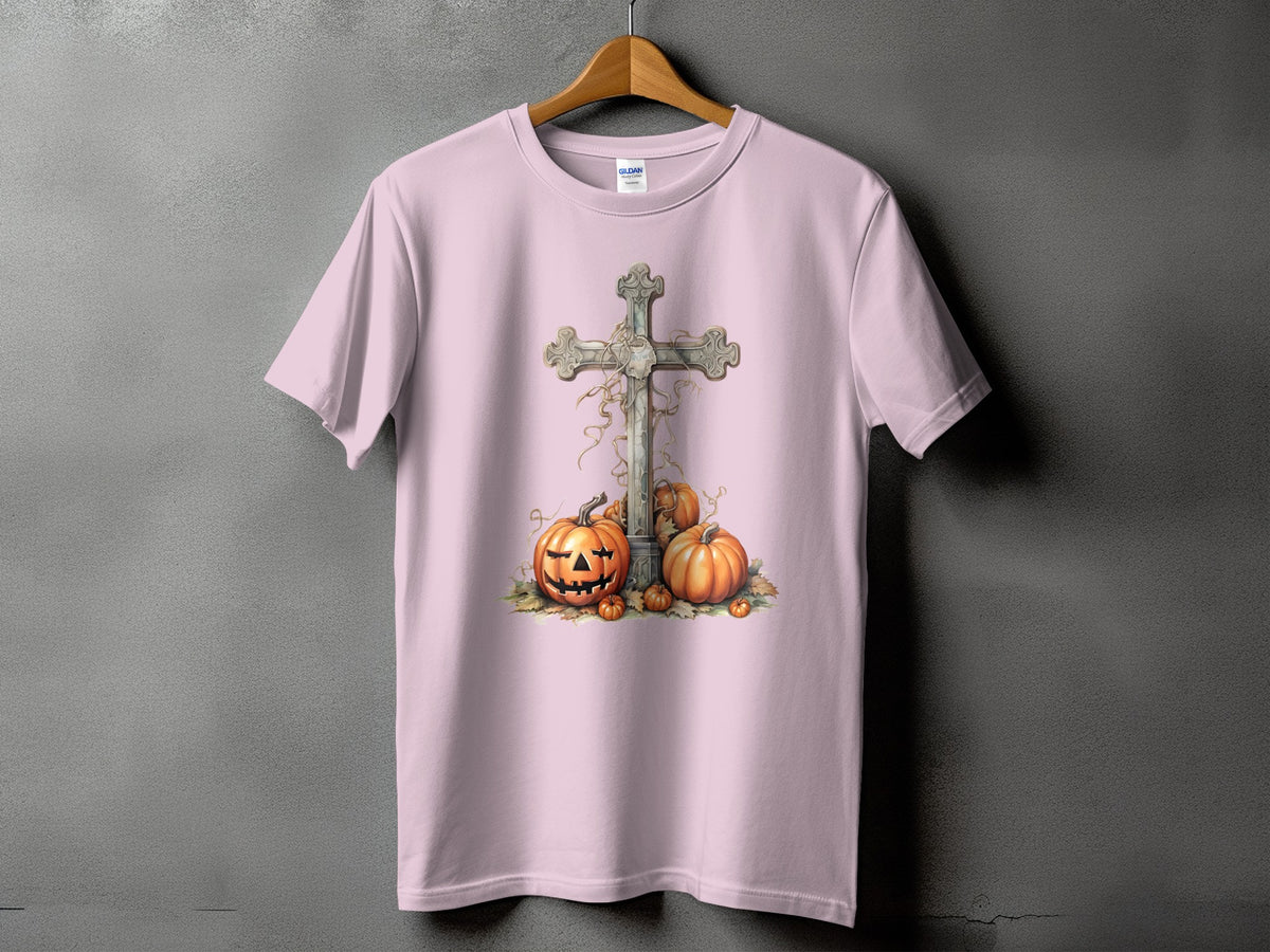 Pink t-shirt with a distressed cross and jack-o'-lanterns graphic design.