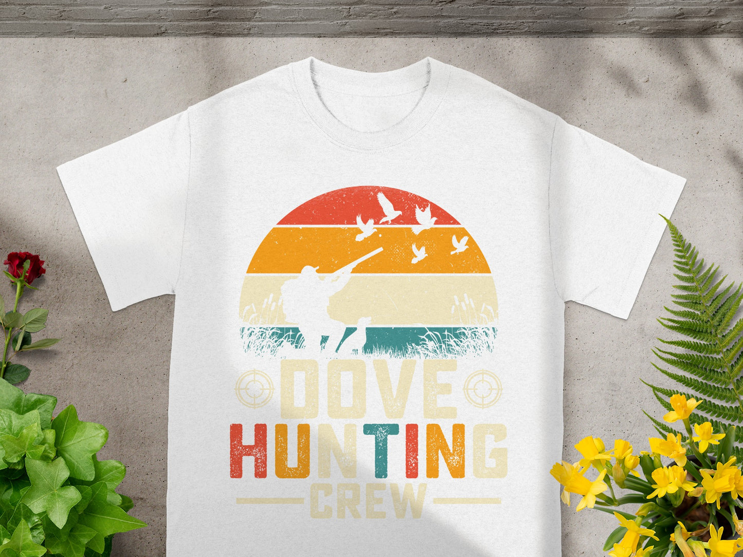 White t-shirt with a graphic of a hunter and doves, reading "Dove Hunting Crew".