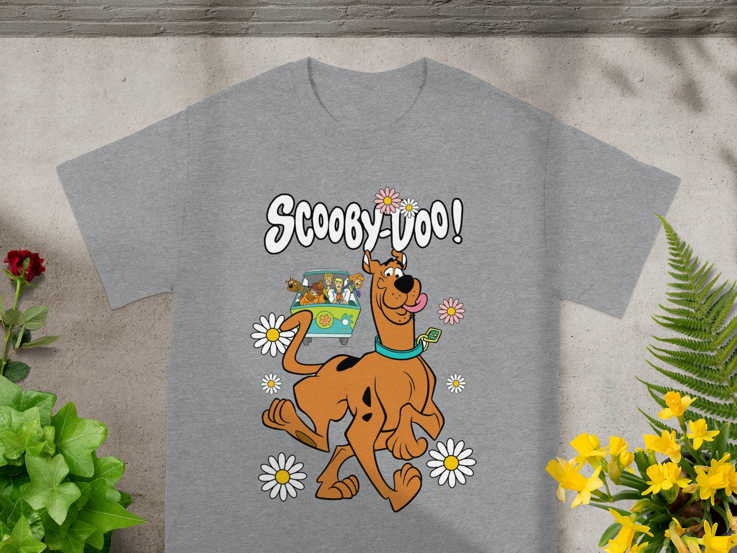 Scooby-Doo text and characters on a gray t-shirt with daisies.