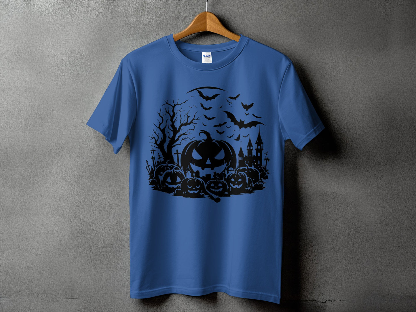 Blue t-shirt with a black Halloween graphic featuring pumpkins, bats, and a haunted house.