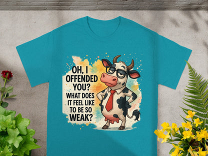 Teal t-shirt with cartoon cow asking "OH, I OFFENDED YOU? WHAT DOES IT FEEL LIKE TO BE SO WEAK?"