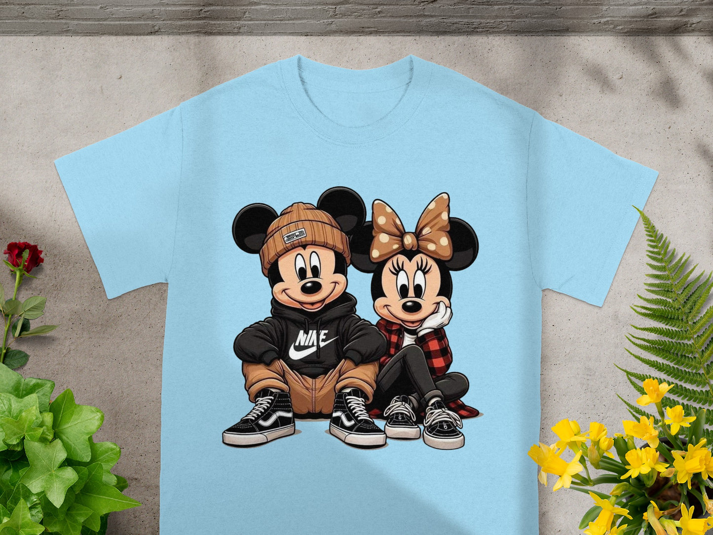 Mickey and Minnie Mouse graphic on a light blue t-shirt.