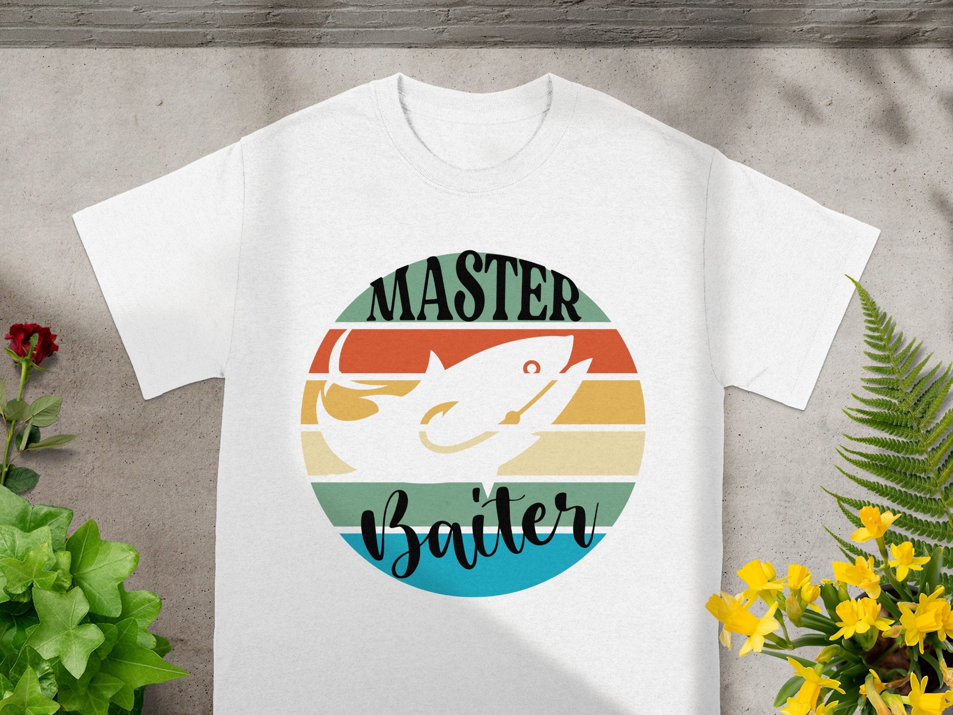 White t-shirt with "Master Baiter" text and fishing lure graphic on striped circle.