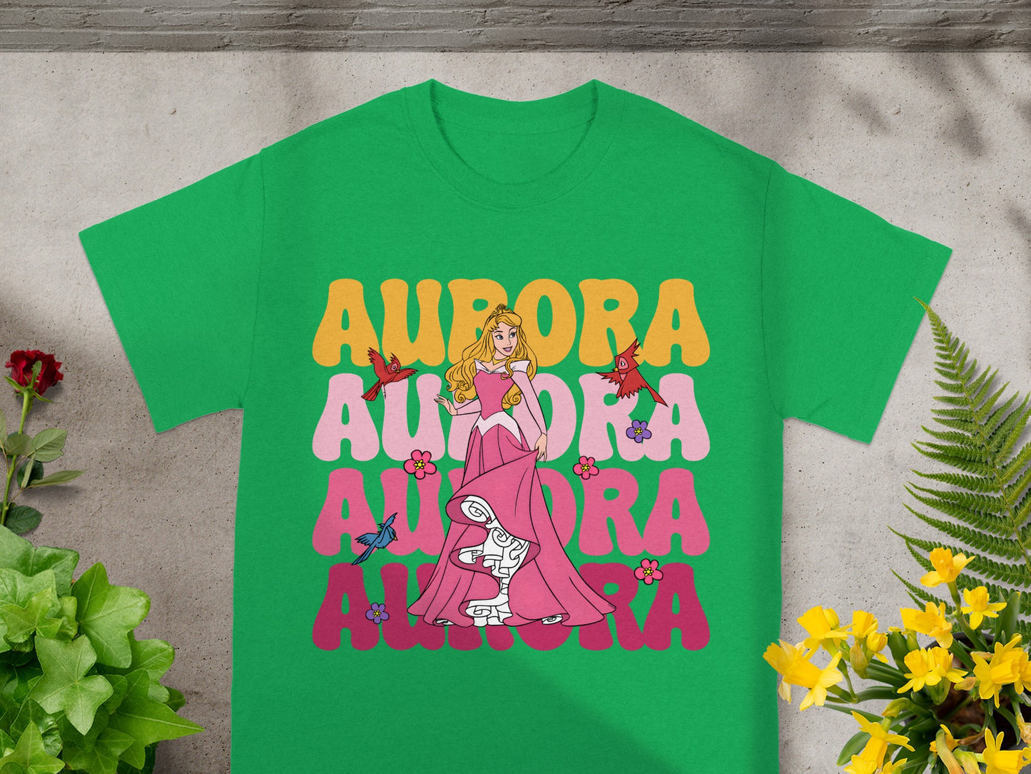 Green t-shirt with Aurora graphic and text.