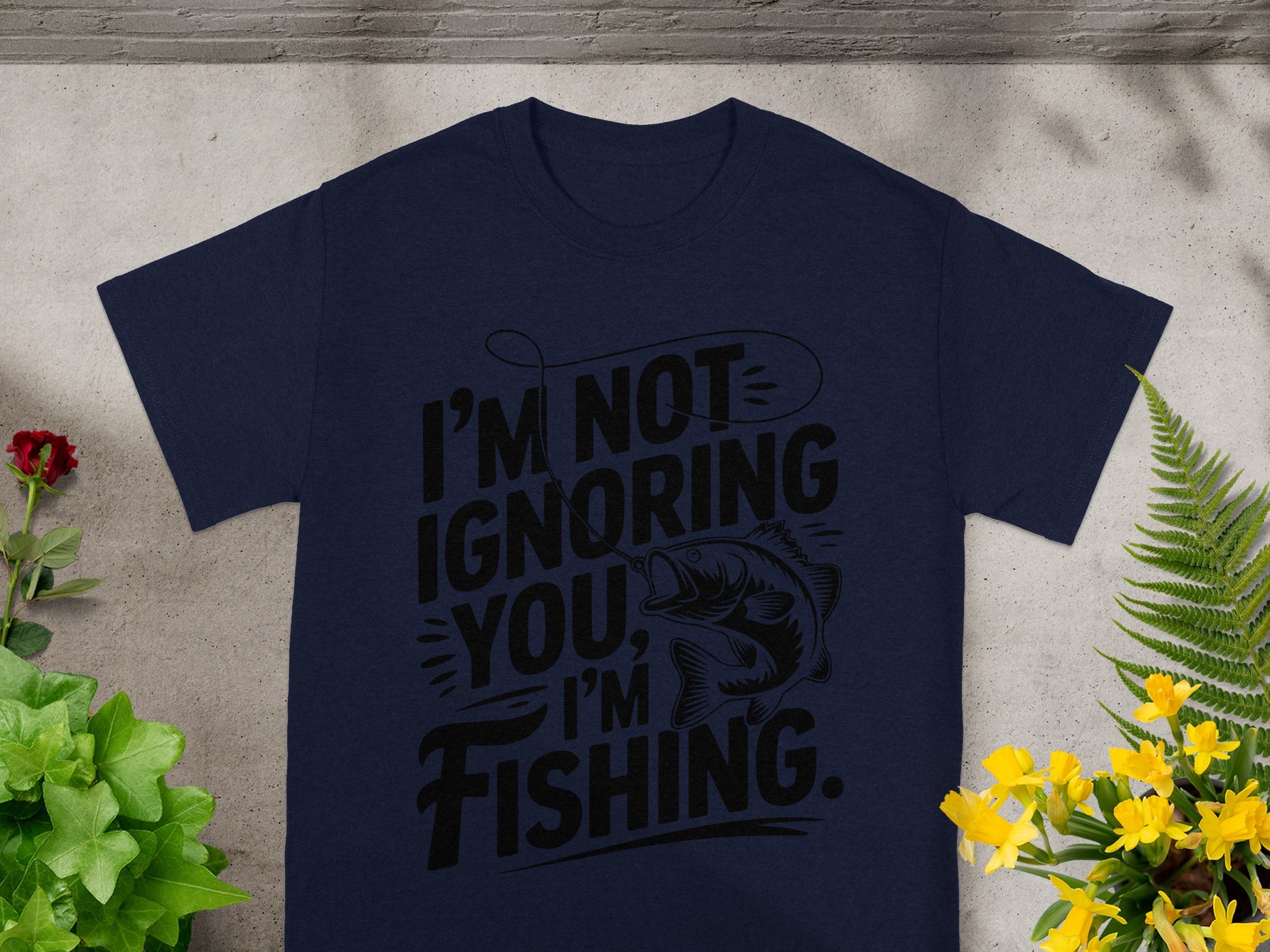Navy t-shirt with black text "I'M NOT IGNORING YOU, I'M FISHING" and a bass.