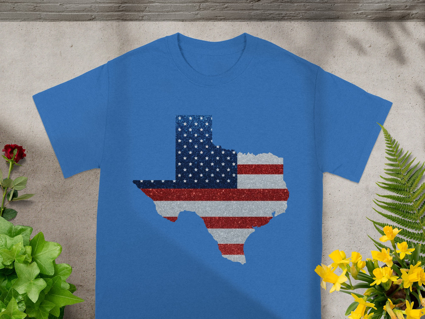 Blue t-shirt with Texas outline filled with US flag pattern and glitter.