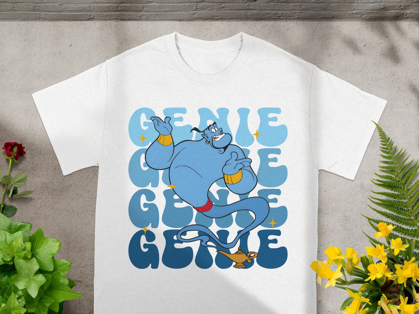 Blue genie with "Genie" text repeated in blue on a white t-shirt.