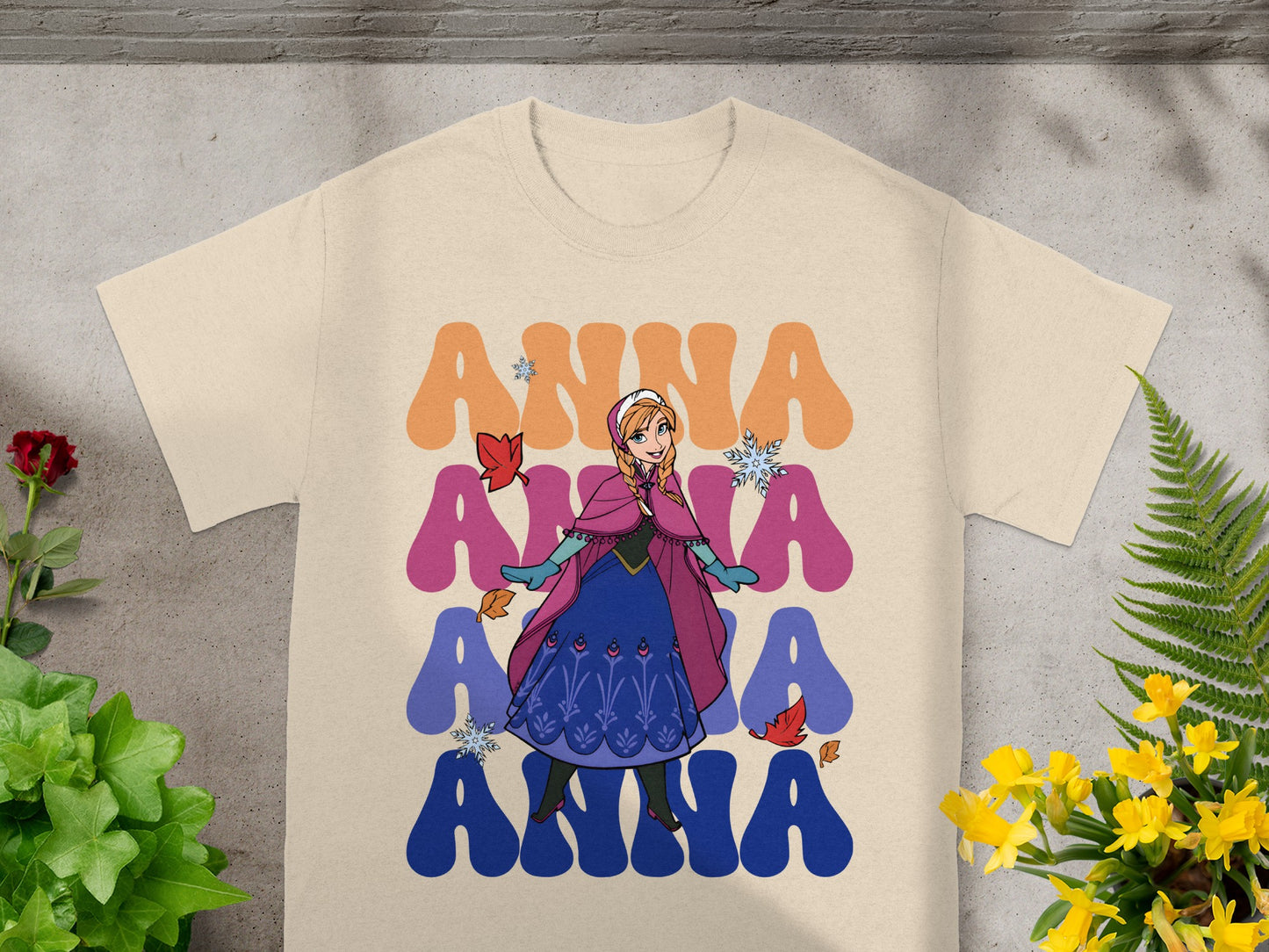 Cream t-shirt with Anna from Frozen and colorful "Anna" text.