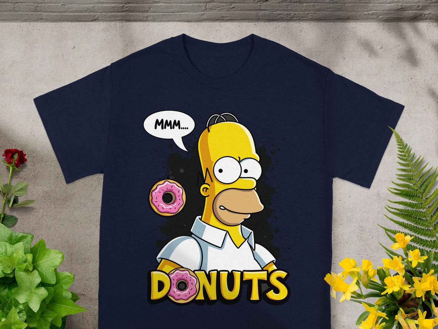 Homer Simpson saying "MMM..." with "DONUTS" text and donut graphic.