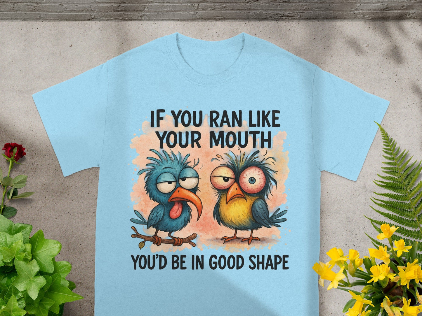 Light blue t-shirt with cartoon birds and text: "If you ran like your mouth you'd be in good shape."