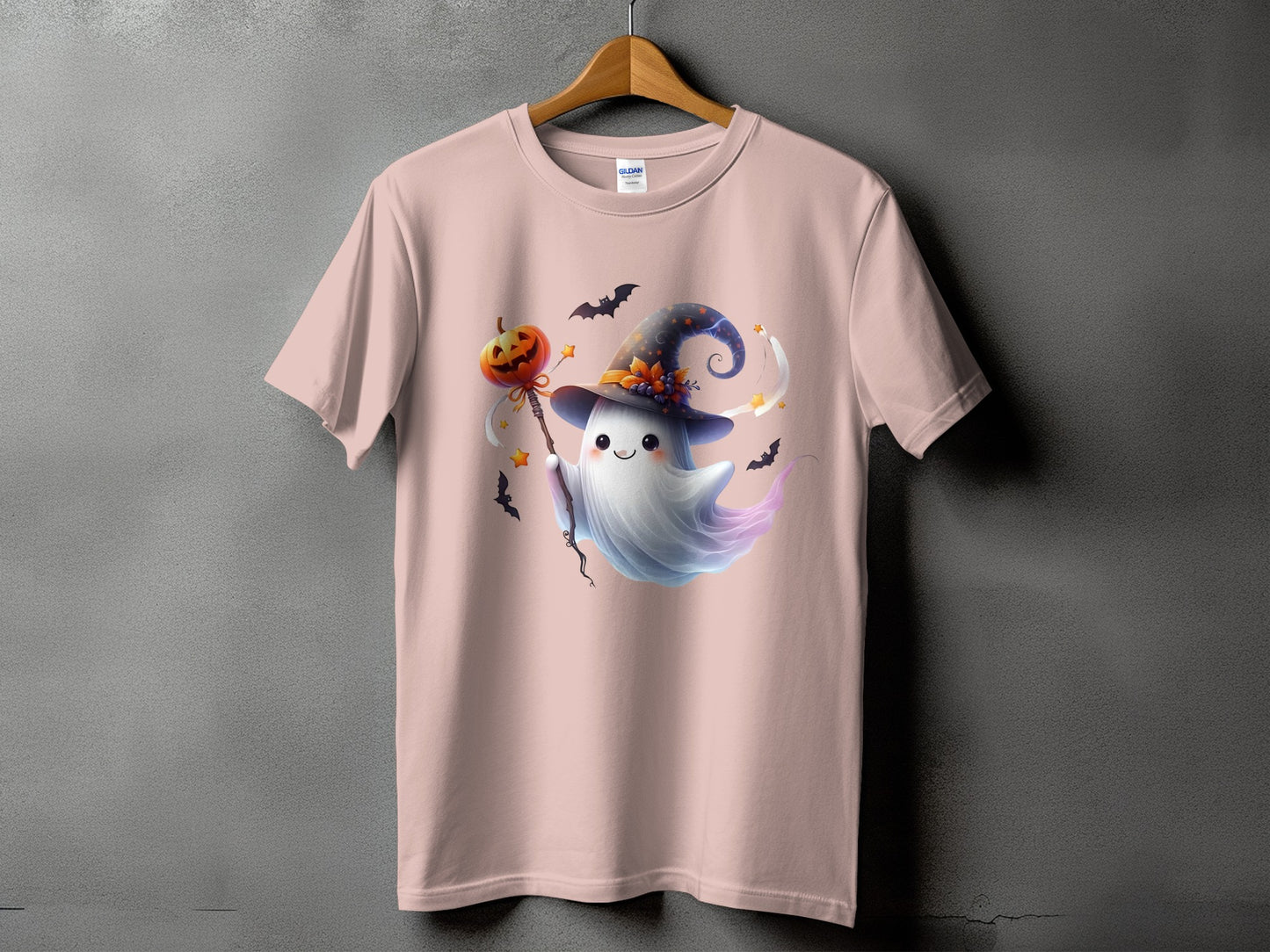Pink t-shirt with a cute ghost holding a jack-o'-lantern wand.
