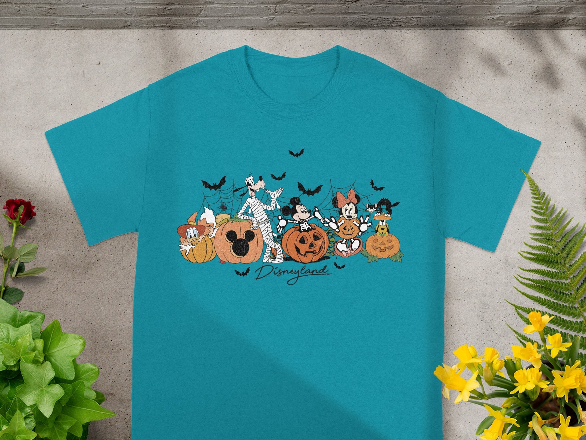 Disneyland t-shirt with Halloween-themed Mickey Mouse characters and pumpkins.