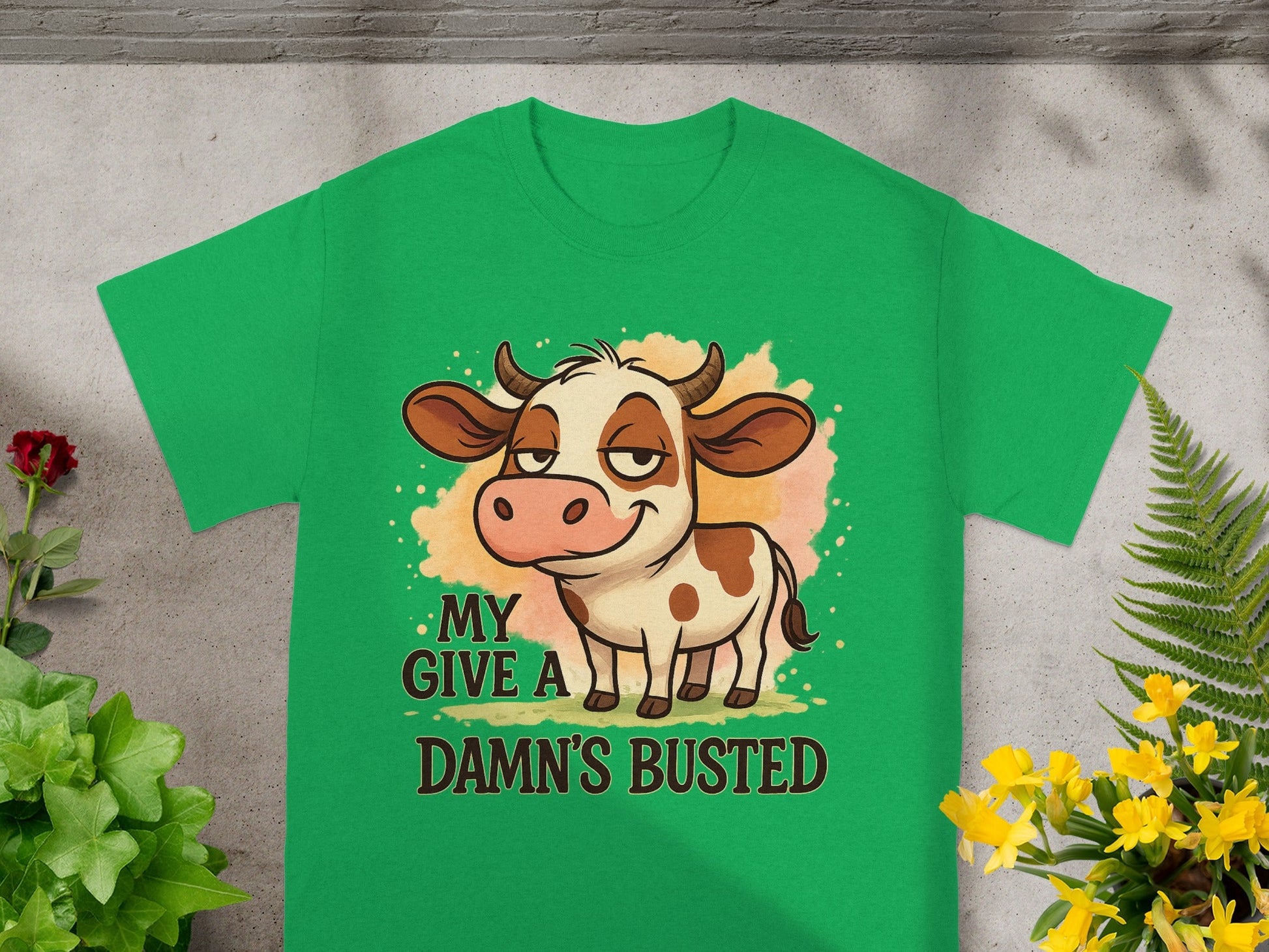 Green t-shirt with cartoon cow and text "MY DAMN'S BUSTED".