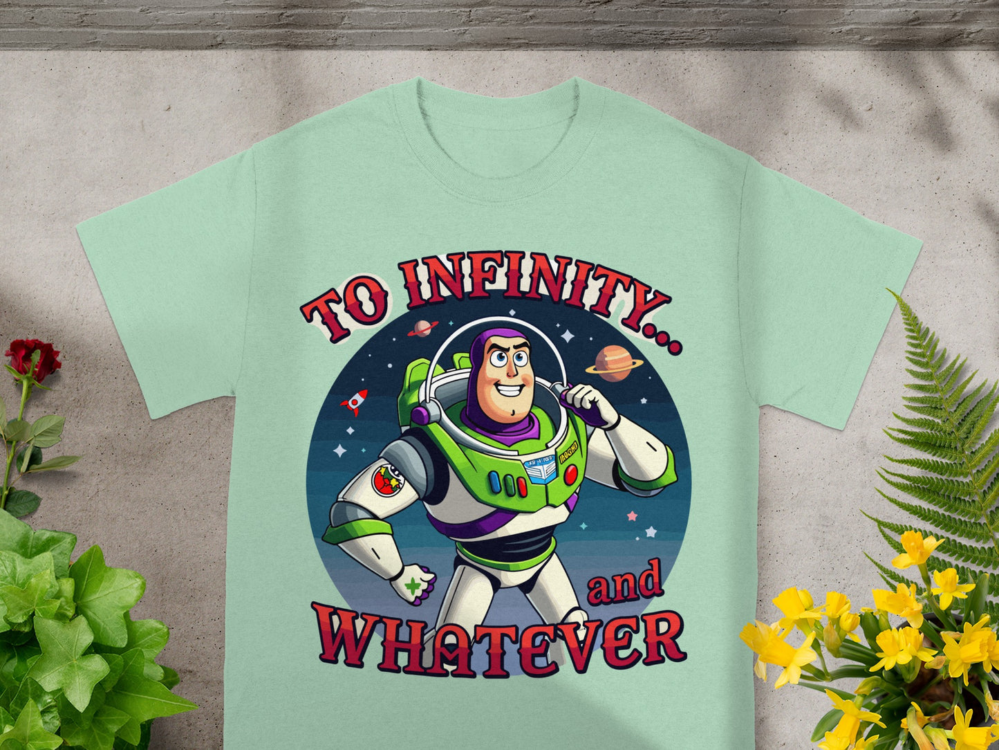 Buzz Lightyear t-shirt with text "To Infinity... and Whatever" on a mint green shirt.