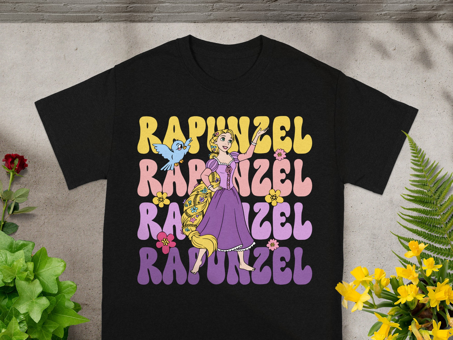 Rapunzel t-shirt with "Rapunzel" text and cartoon character illustration.