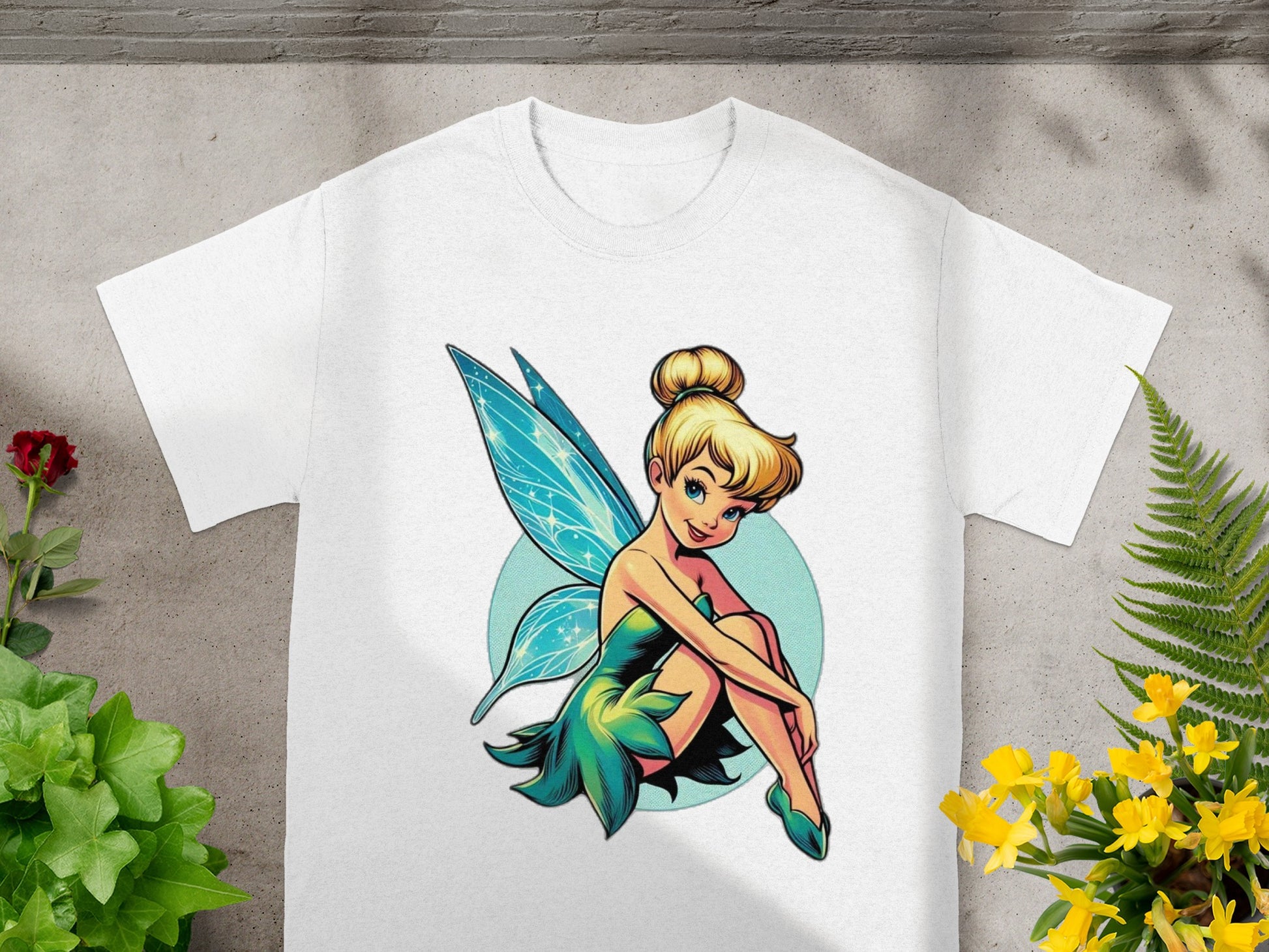 White t-shirt with a cartoon of Tinkerbell.