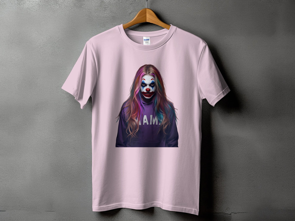 Pink t-shirt with a graphic of a clown wearing a purple hoodie with "MAIM" on it.